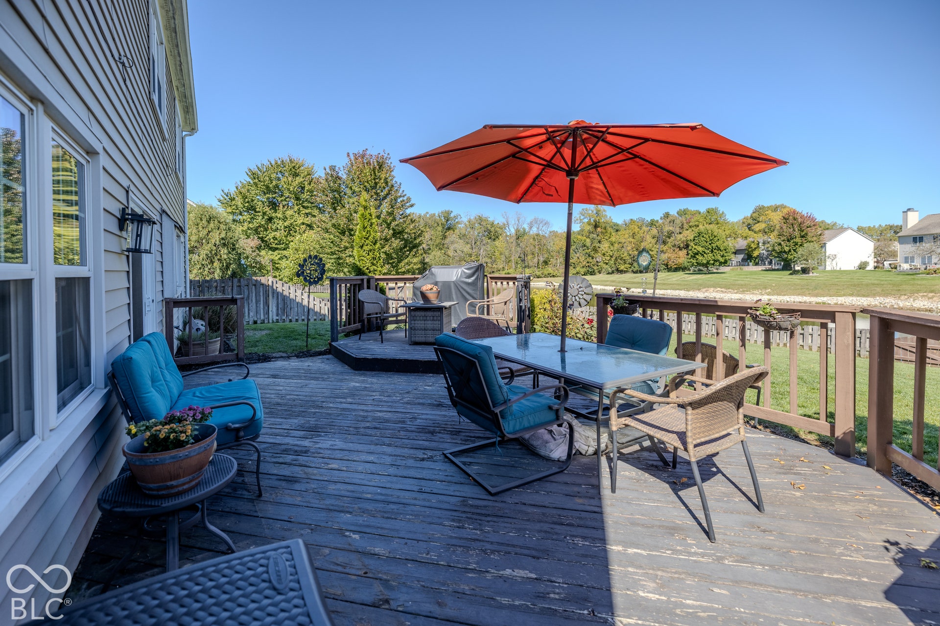 6416 Manchester Drive, Fishers, IN 46038 The expansive wood deck overlooks the pond and backyard. This is the perfect place for outdoor entertaining or enjoying your favorite morning beverage.