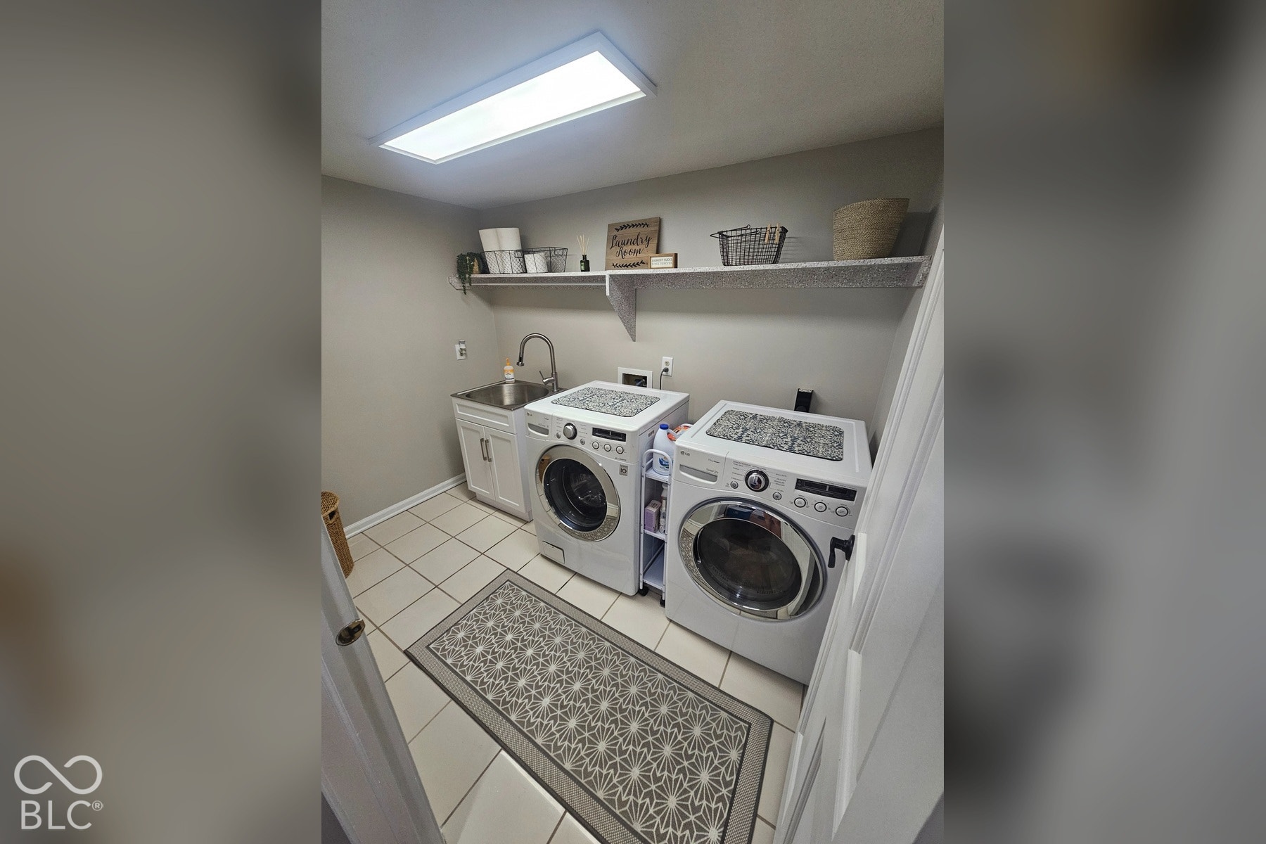 6416 Manchester Drive, Fishers, IN 46038 The laundry room is spacious and inviting with tile floors and bright lighting.