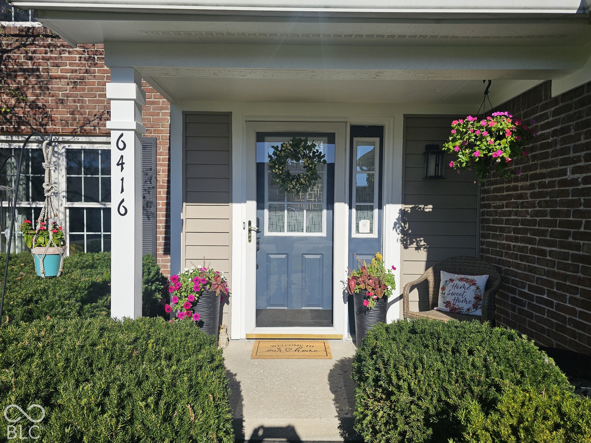 6416 Manchester Drive, Fishers, IN 46038 A warm welcome begins here, with beautiful landscaping, timeless brick, and a covered front porch that adds charm and character.