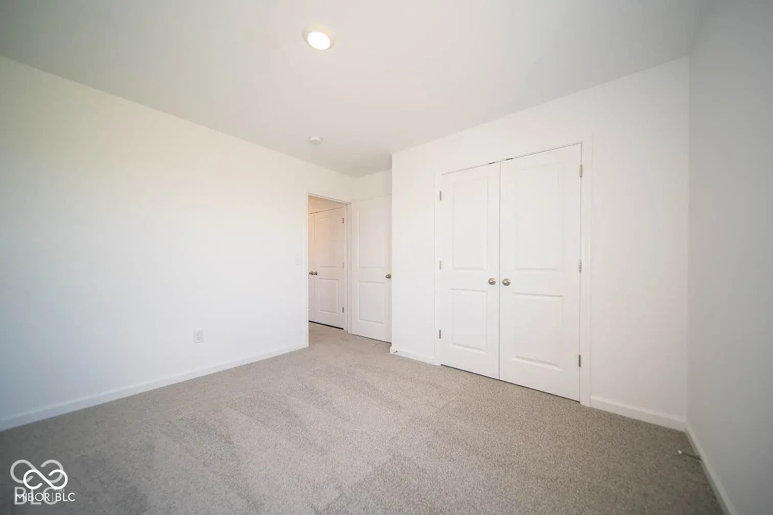 5778 Aleppo Lane, Greenwood, IN 46143 Recessed ceiling lighting, white walls, light-toned carpet, and a bi-fold closet door