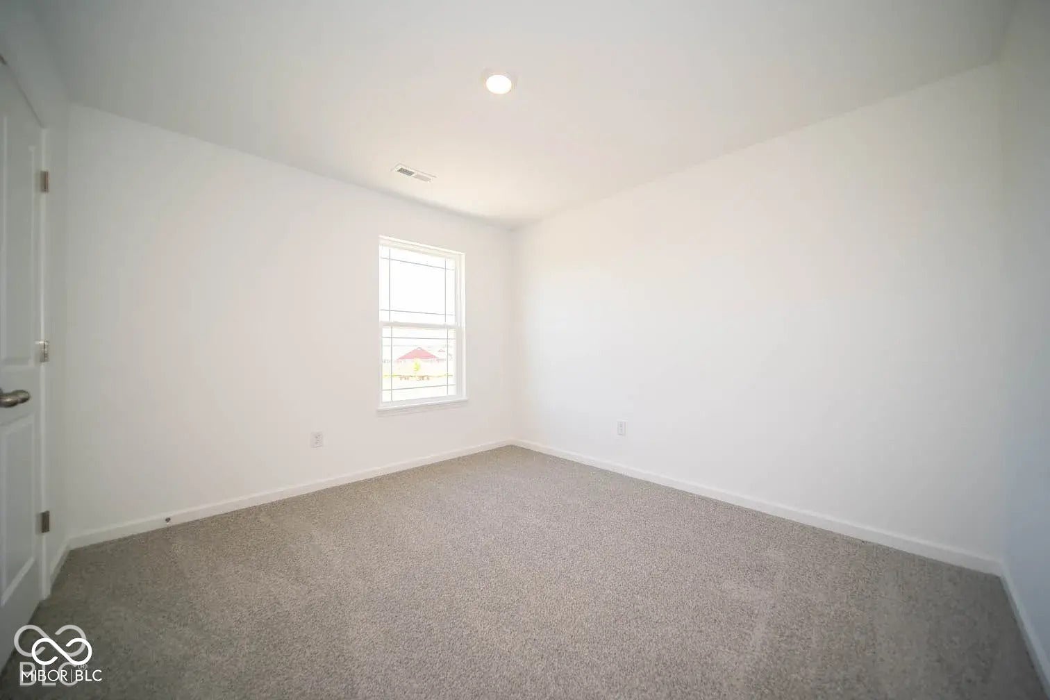 5778 Aleppo Lane, Greenwood, IN 46143 Recessed ceiling lighting, white painted walls, carpeted flooring, and a single window with white trim