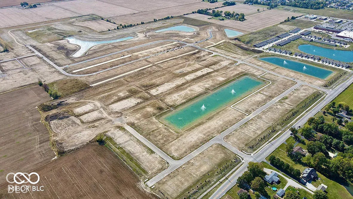5778 Aleppo Lane, Greenwood, IN 46143 Expansive land parcels featuring established roads, multiple water features, and surrounding agricultural areas