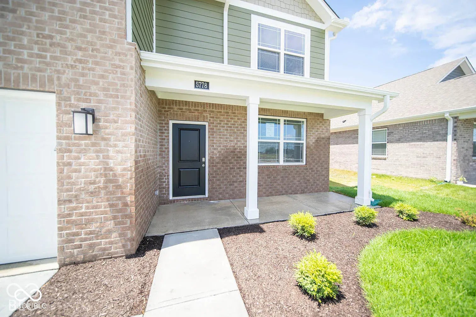 5778 Aleppo Lane, Greenwood, IN 46143 Brick and siding exterior with covered entry