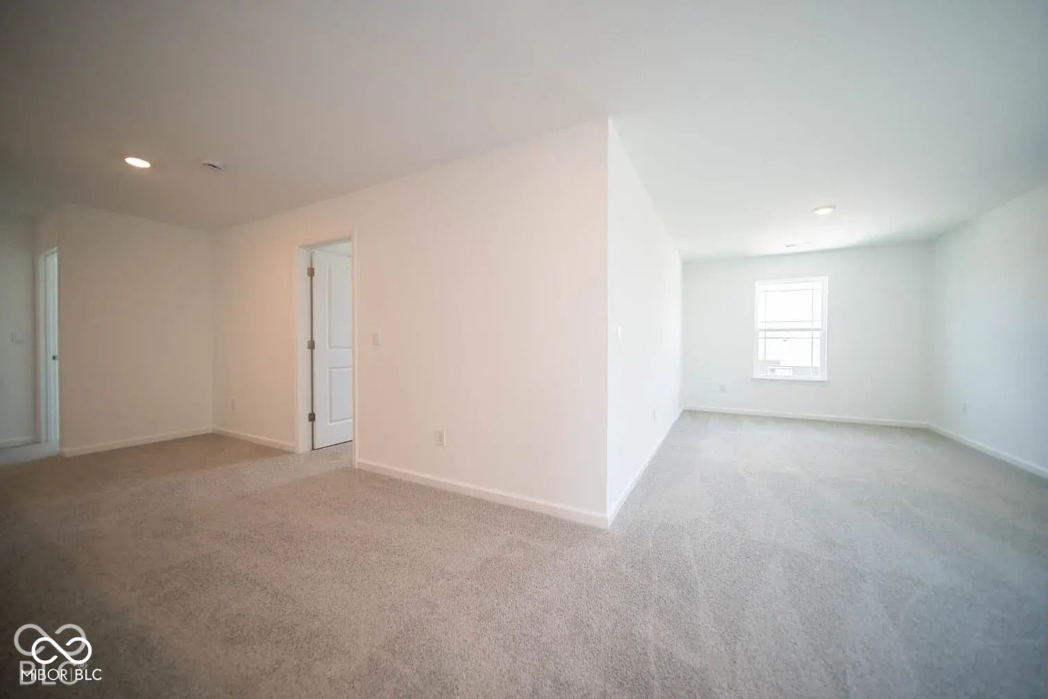 5778 Aleppo Lane, Greenwood, IN 46143 Recessed lighting, light-colored carpeting, white interior walls, interior door, and window with white trim