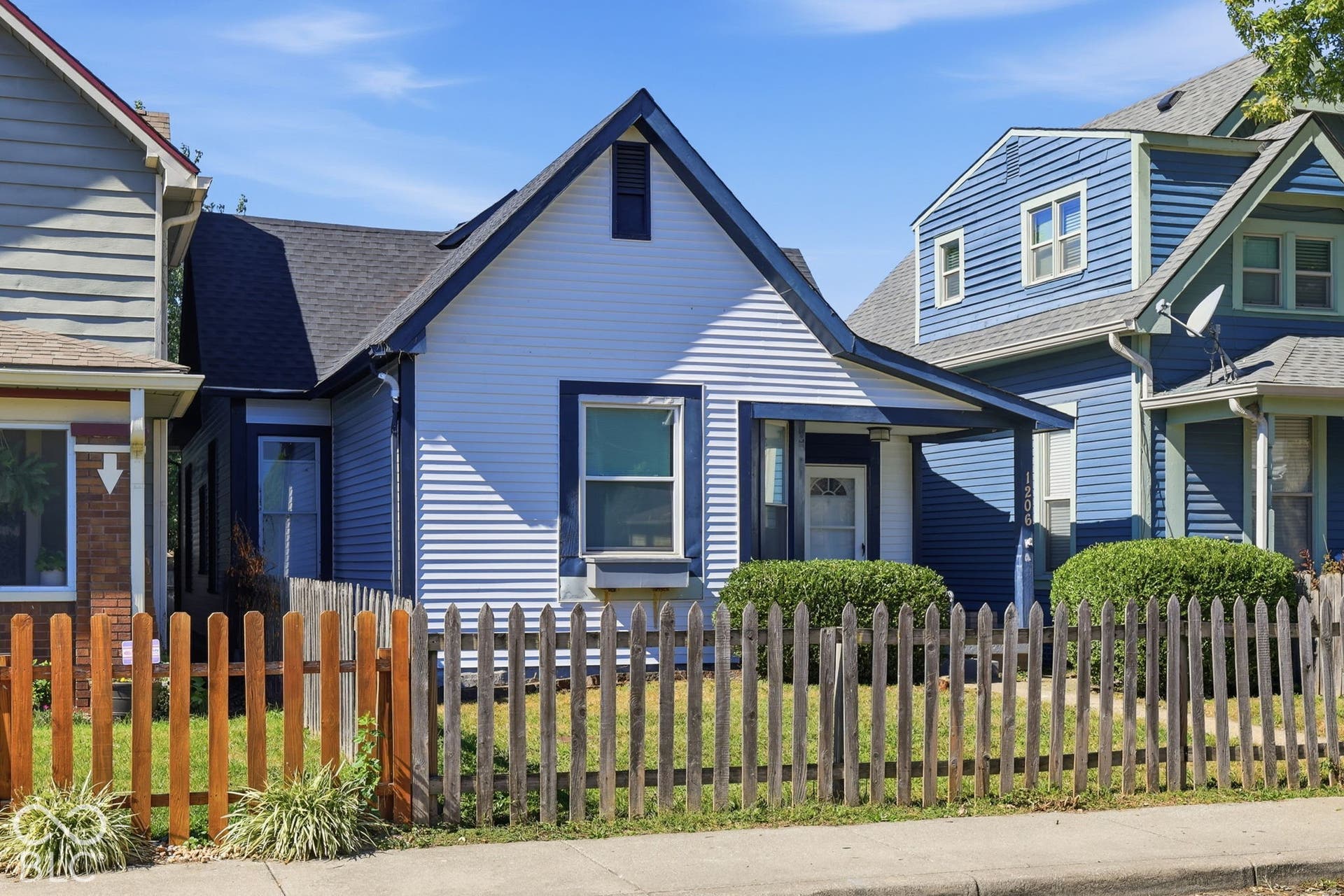 Gabled roofline with dark shingles