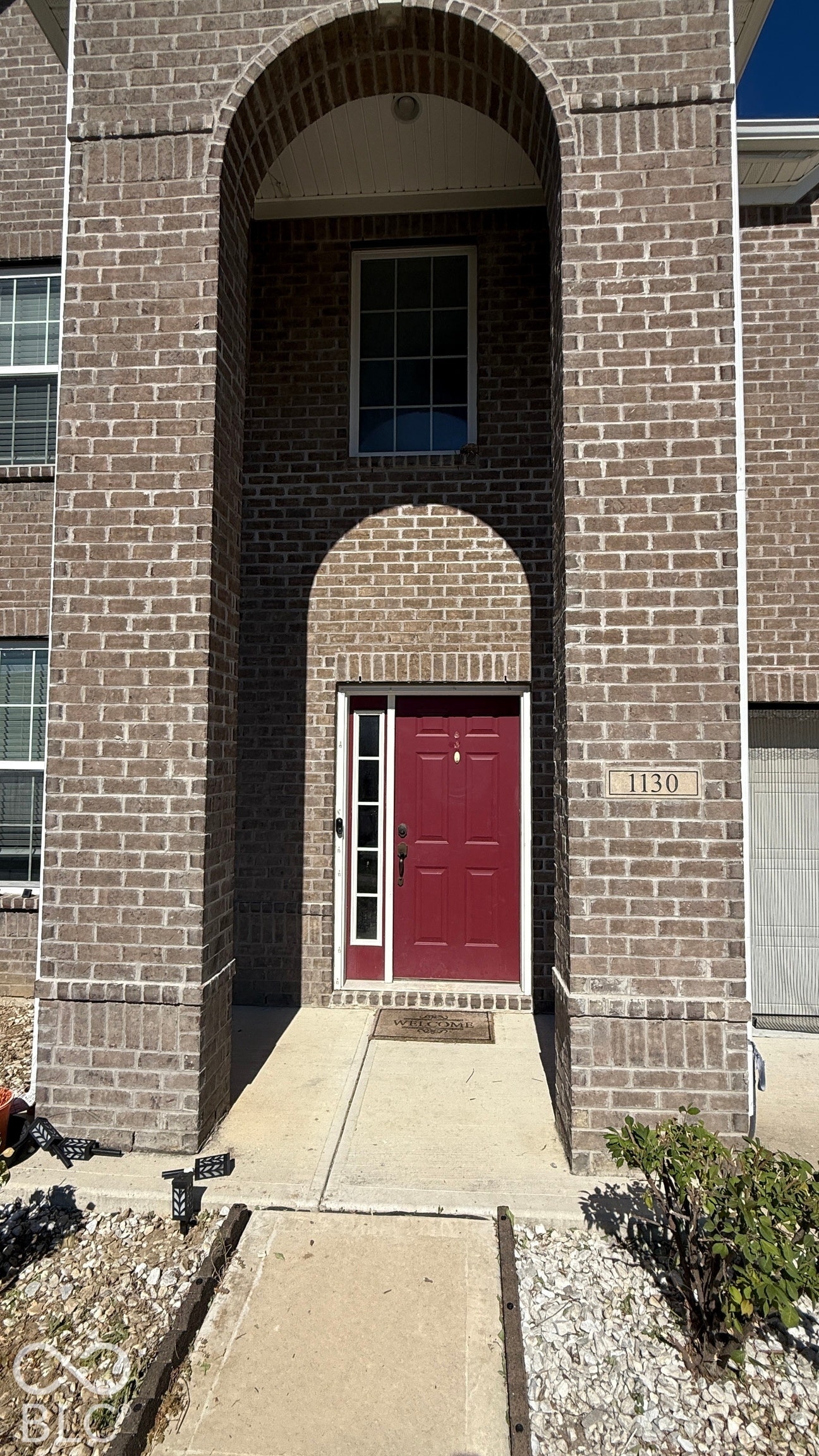 Brick exterior with arched entryway
