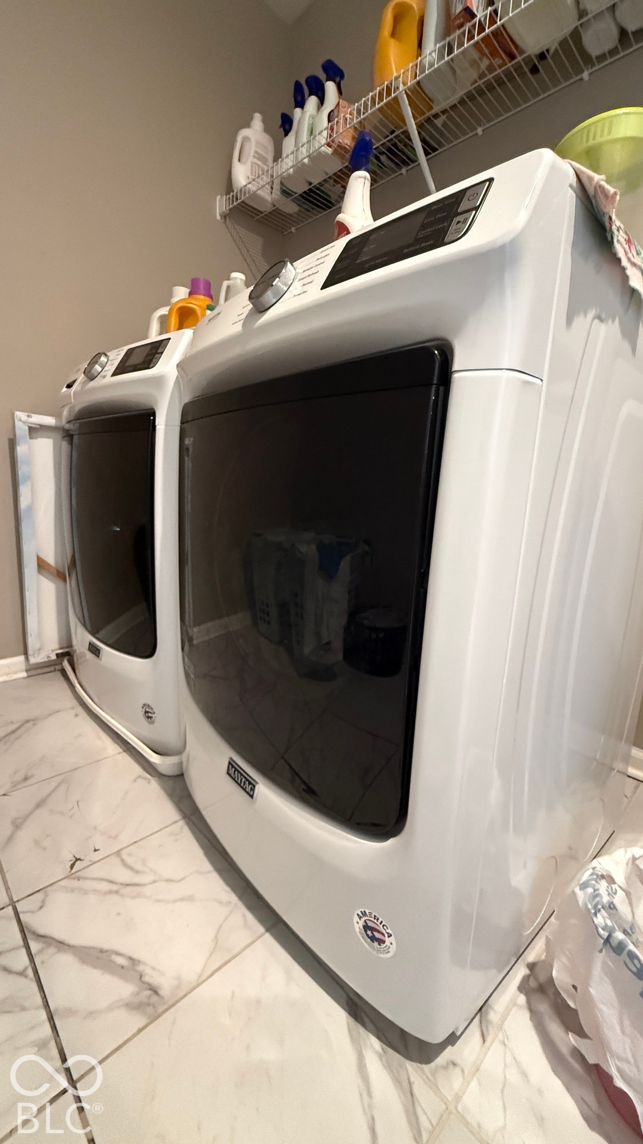 White appliances with dark glass doors and digital controls