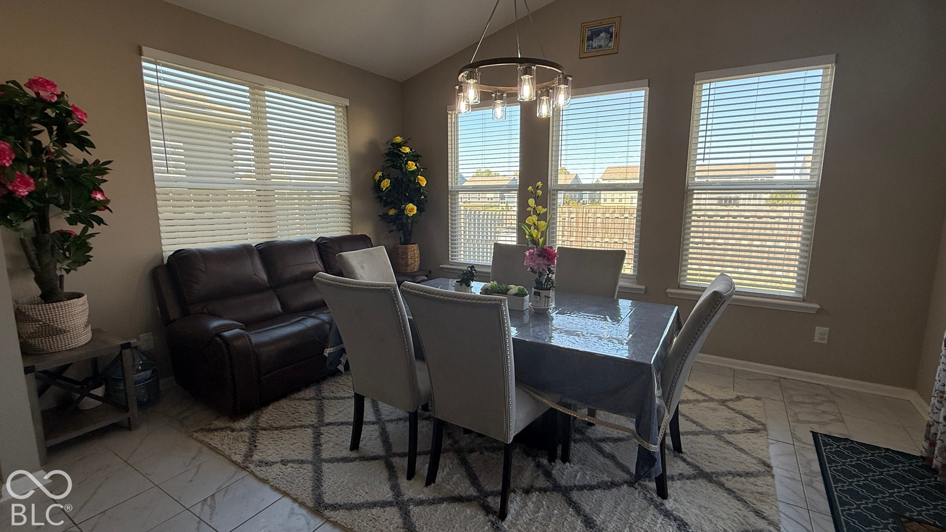 Vaulted ceiling with a chandelier light fixture