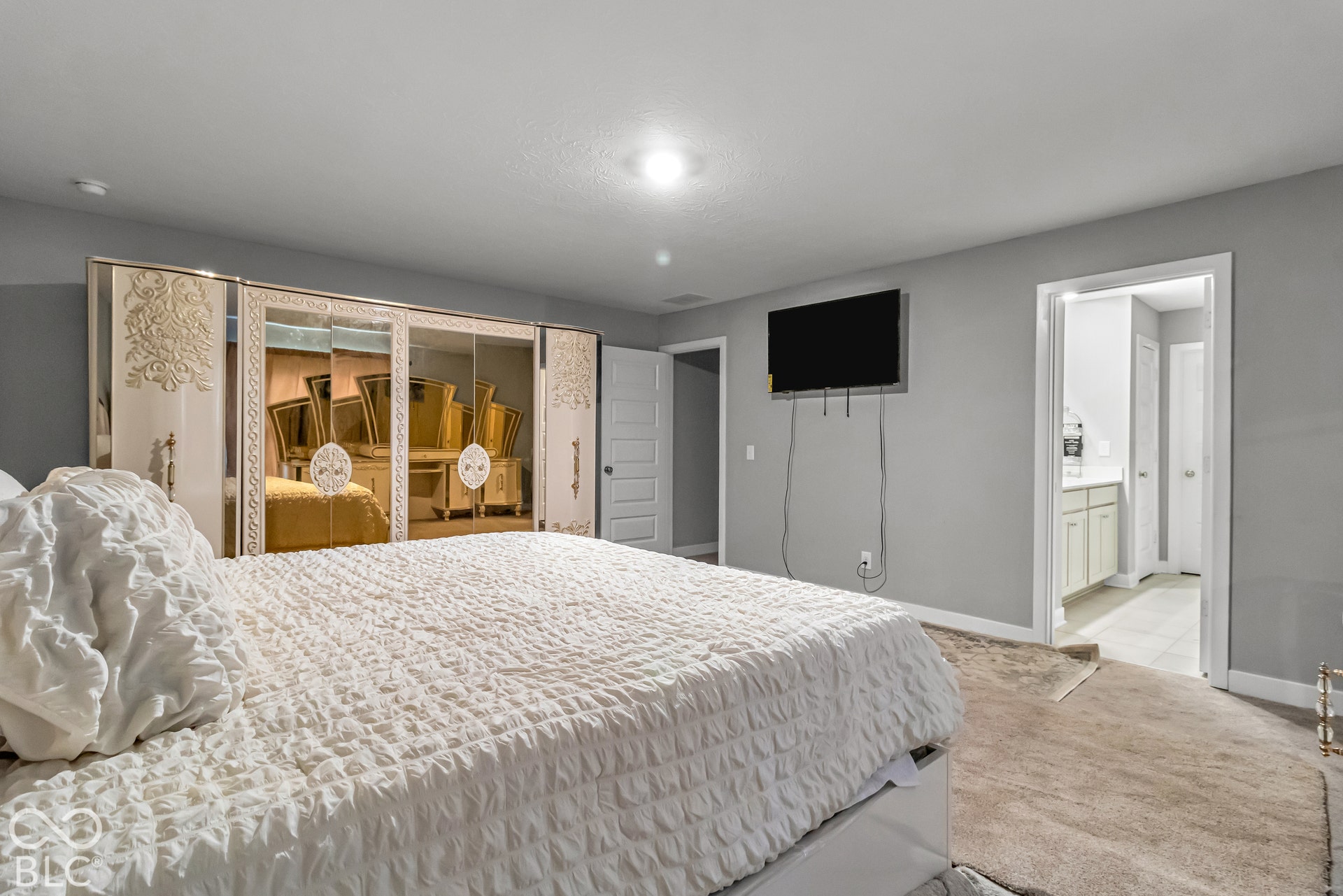 Plush carpeting and light gray wall tones
