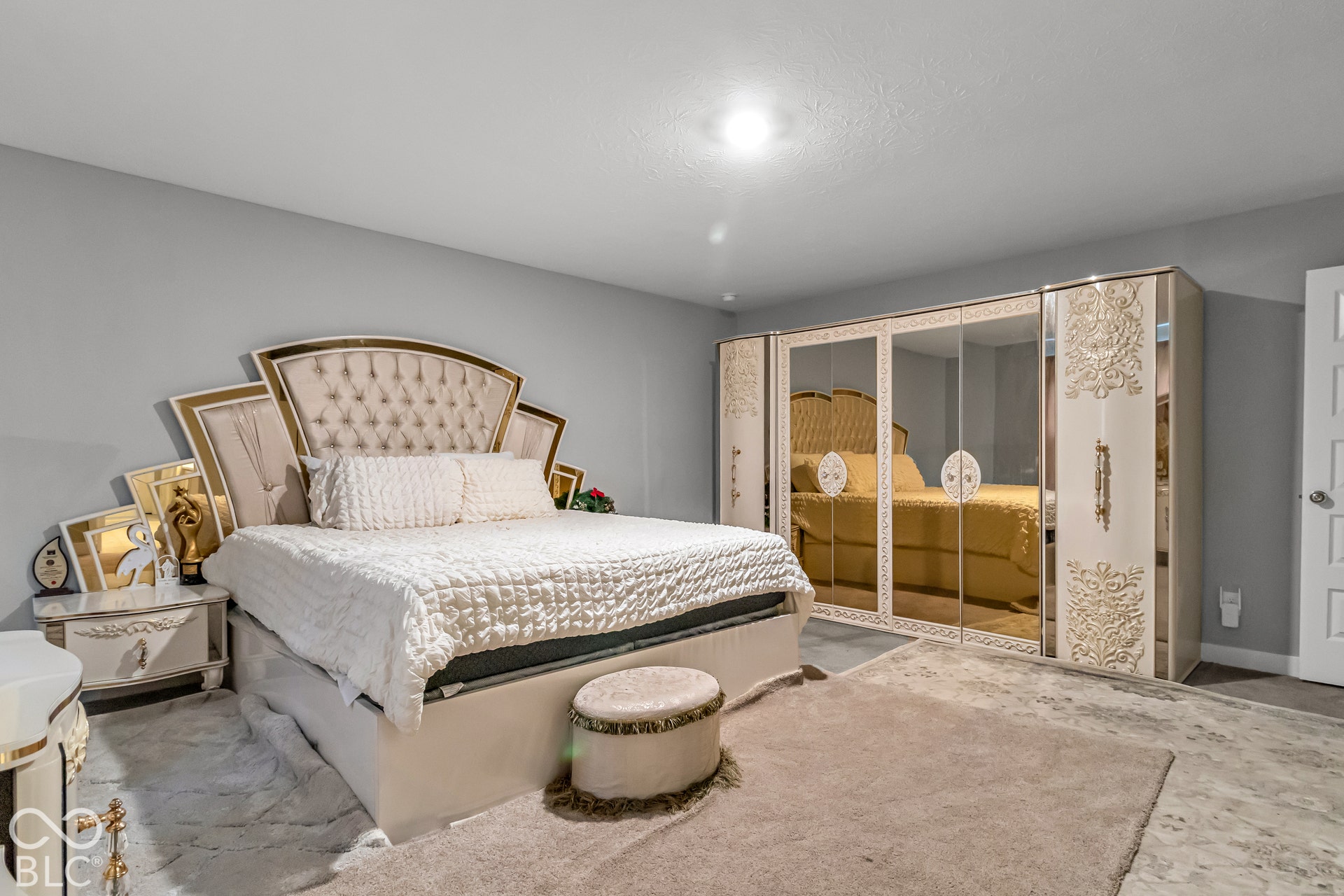 Mirrored built-in wardrobe with decorative detailing