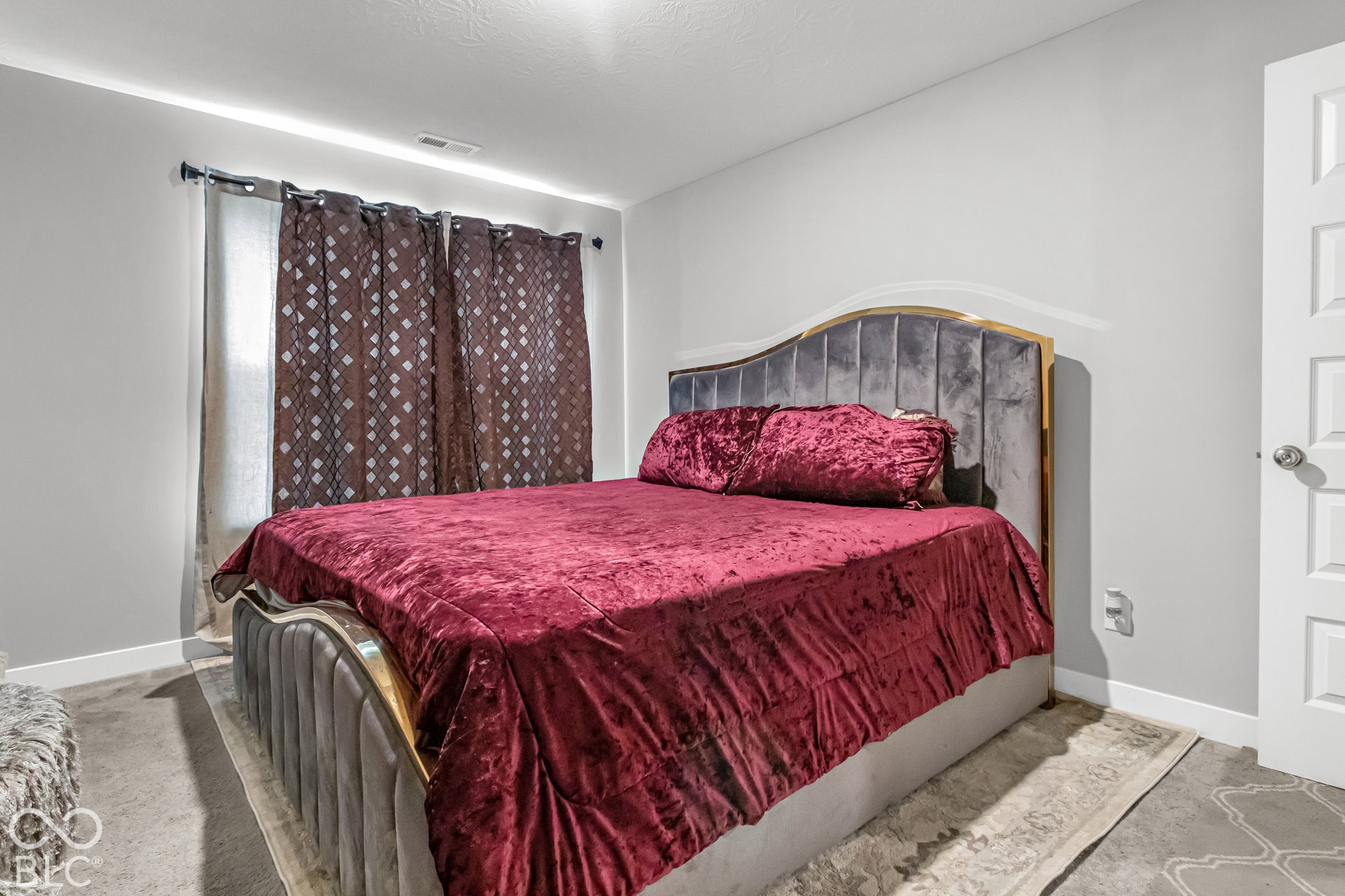 Recessed lighting, light gray wall color, paneled door, and carpet flooring