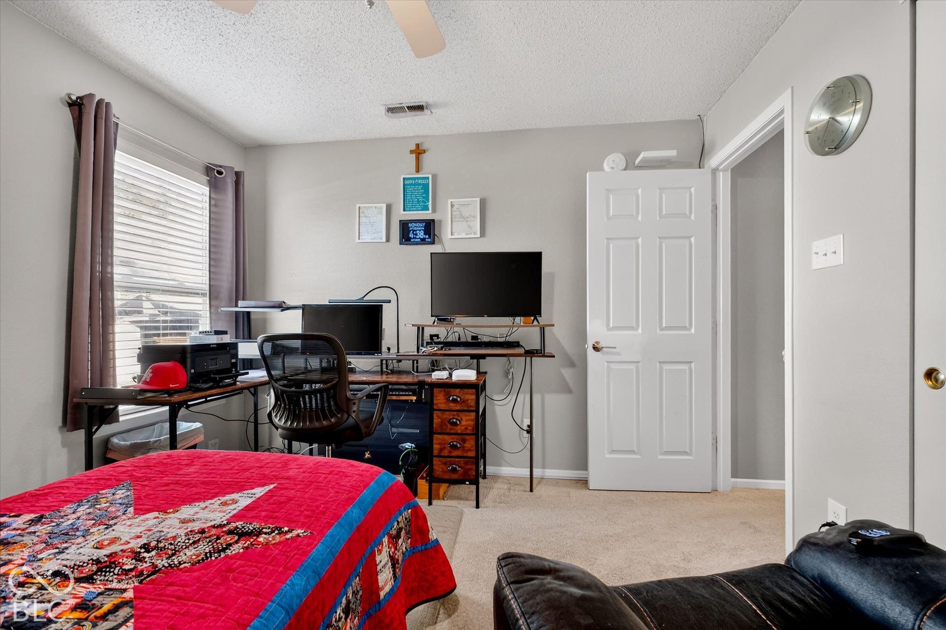 12980 Coyote Run, Fishers, IN 46038 Neutral wall paint, textured ceiling, carpeted flooring, window with blinds and drapes, white paneled door