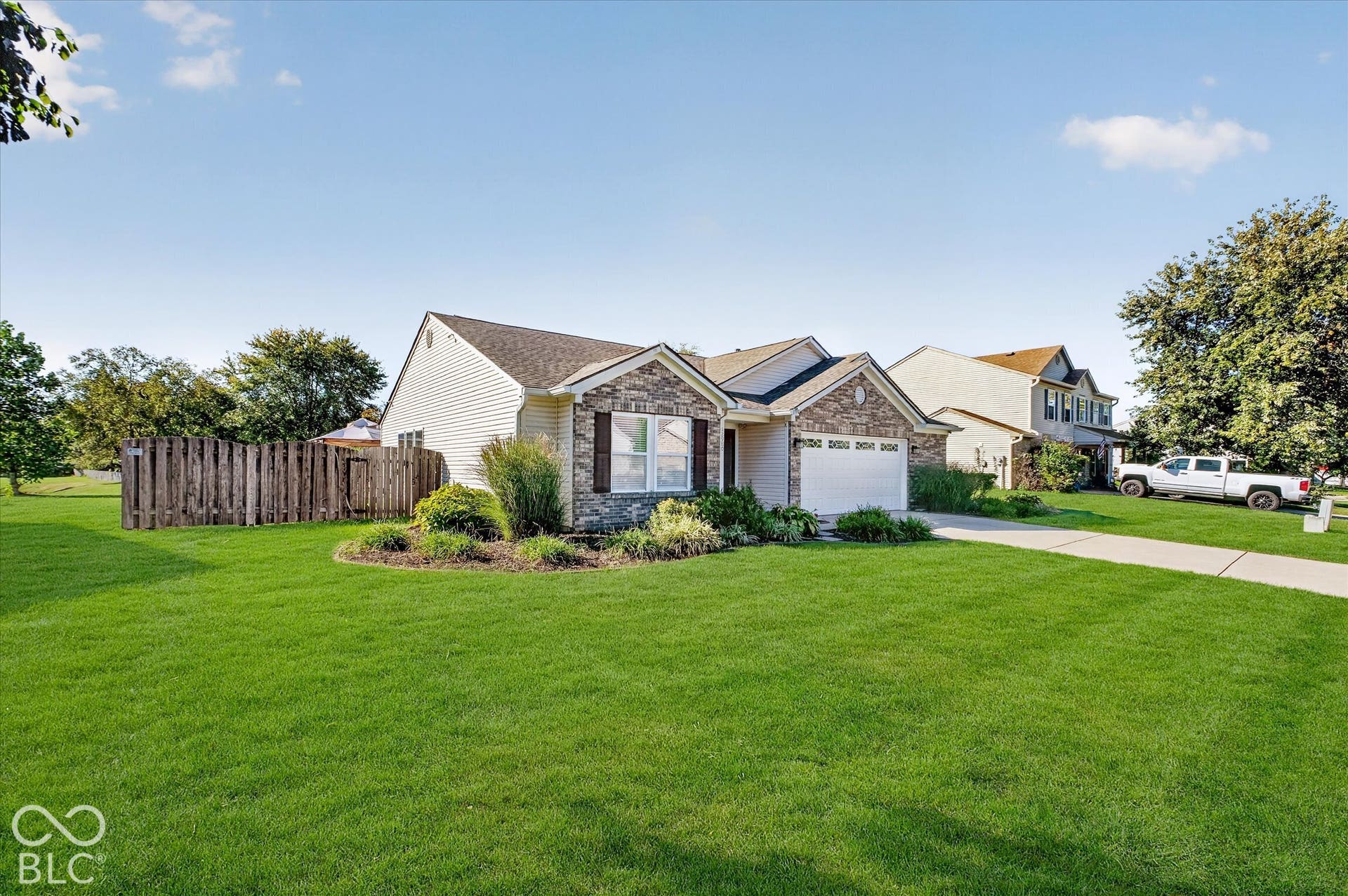 12980 Coyote Run, Fishers, IN 46038 Stone and siding exterior with a pitched roof