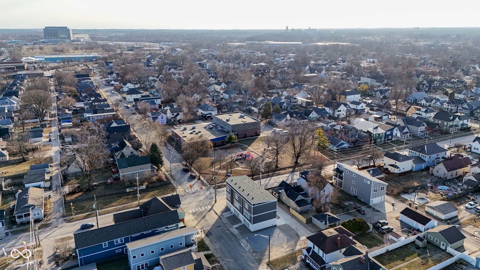 aerial view of property's location with nearby suburban area