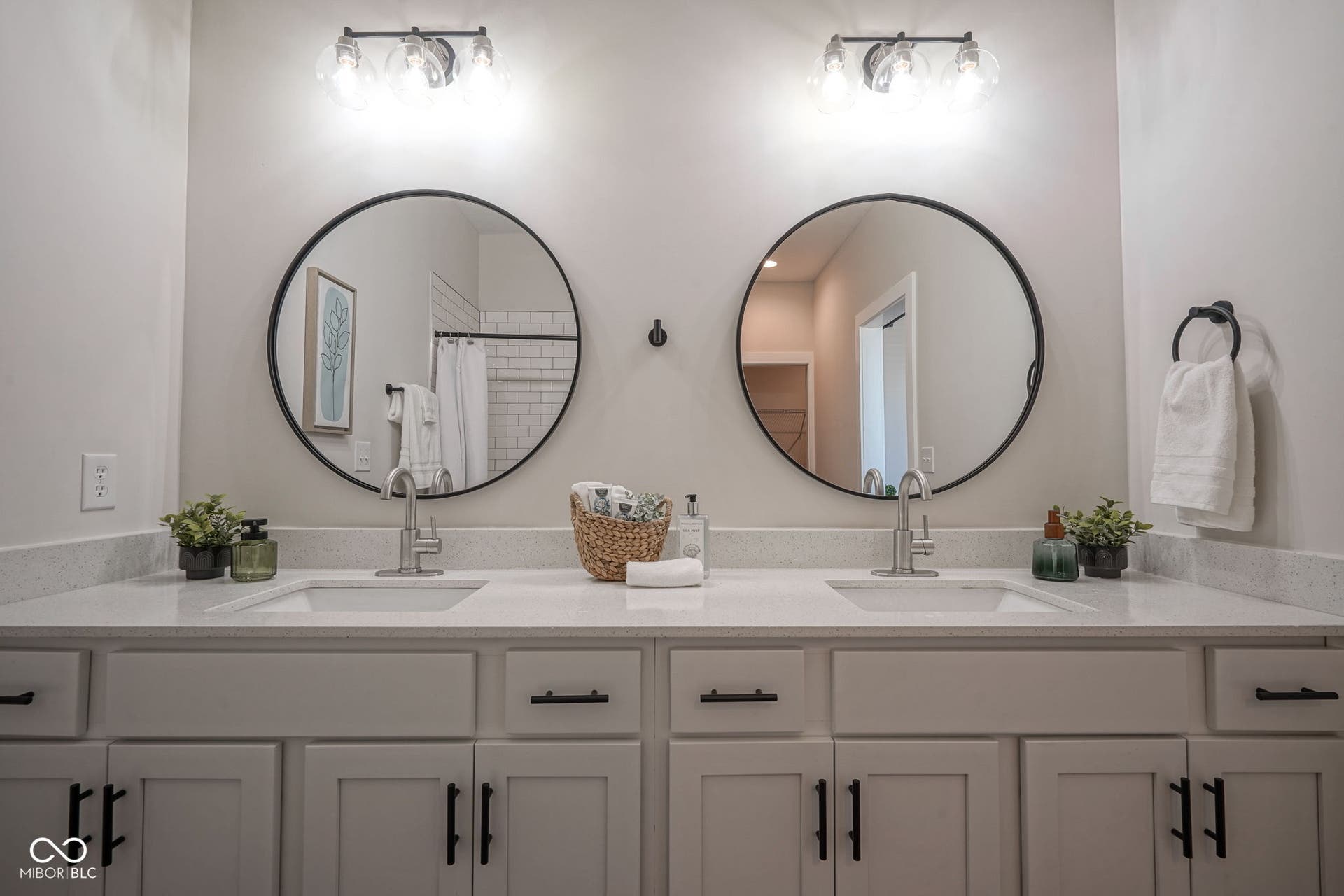 bathroom featuring double vanity and a shower with shower curtain