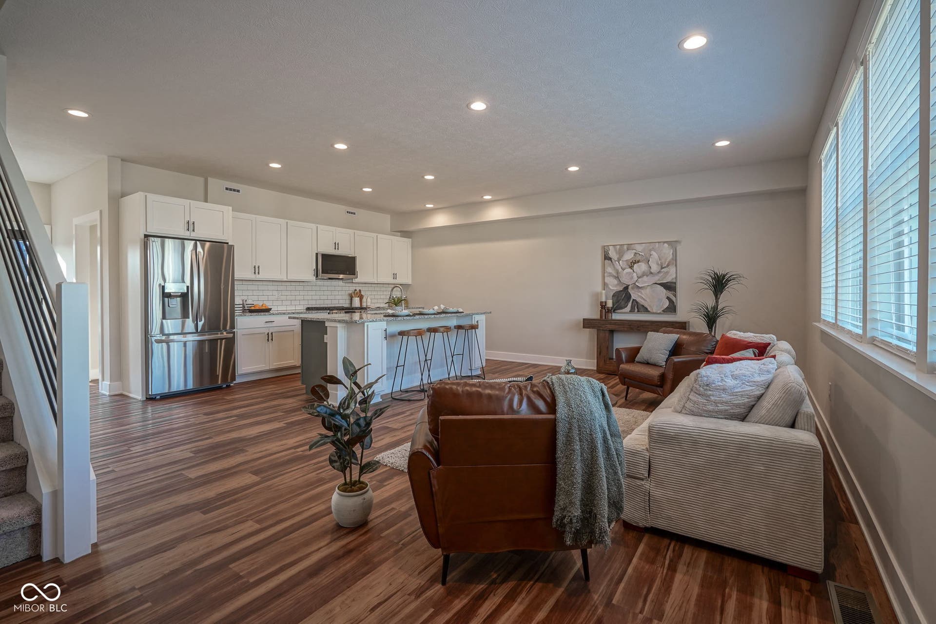 living area with stairway, dark wood finished floors, and recessed lighting