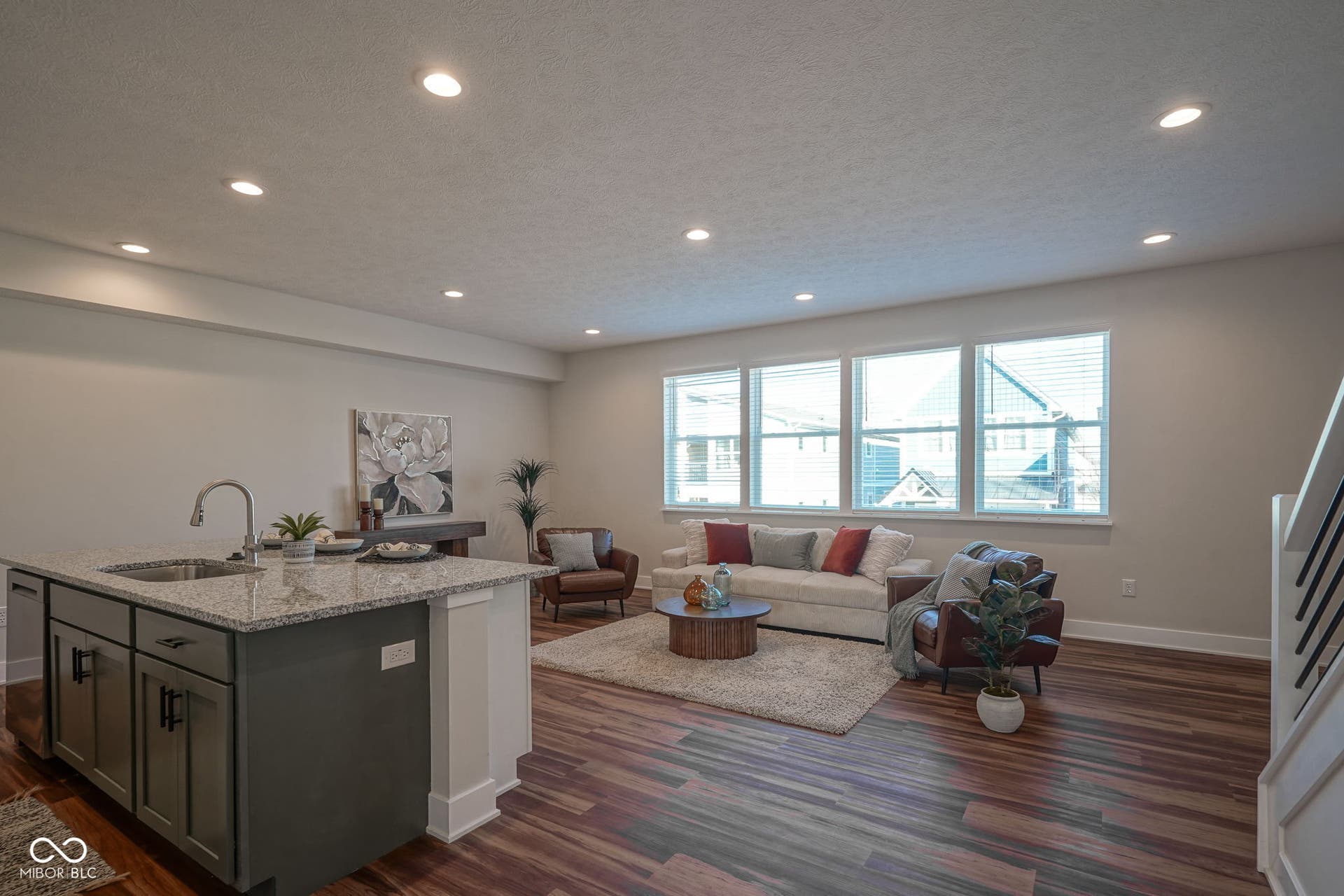 living room featuring recessed lighting, dark wood finished floors, and a textured ceiling