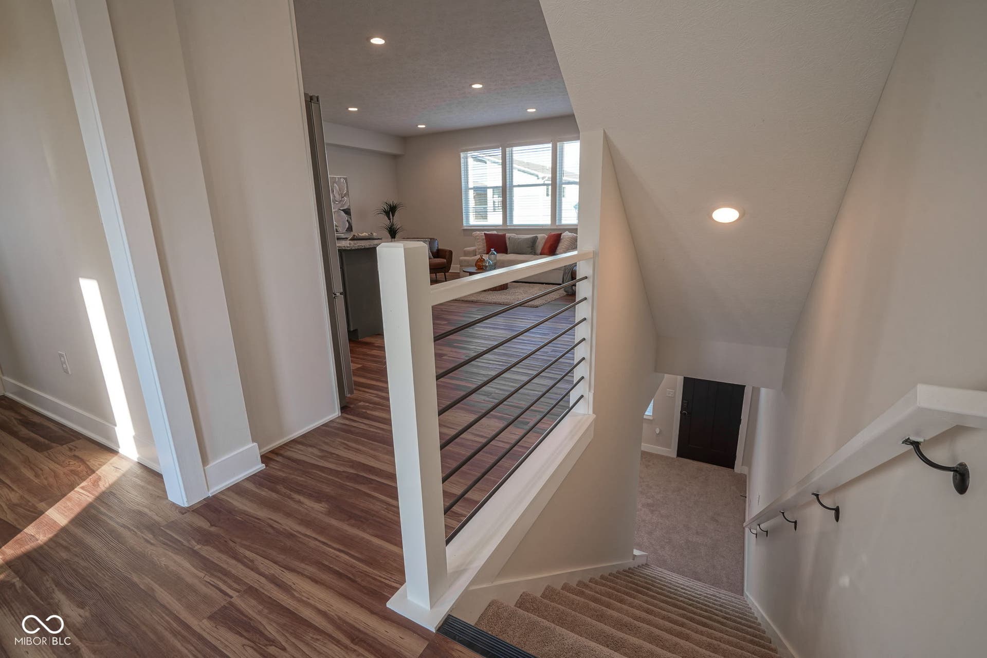 staircase featuring recessed lighting and wood finished floors
