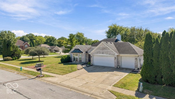 Brick exterior with a two-car garage
