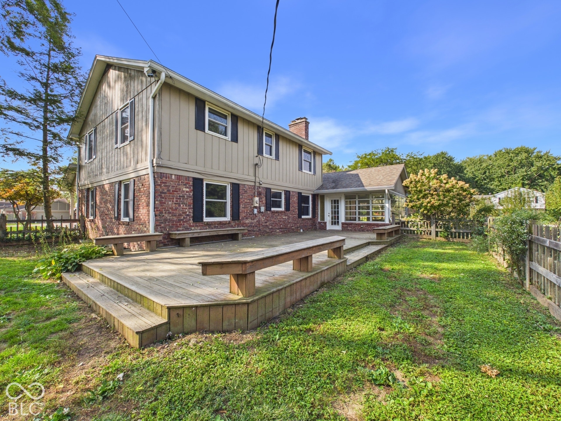 Multi-level wood deck with integrated benches