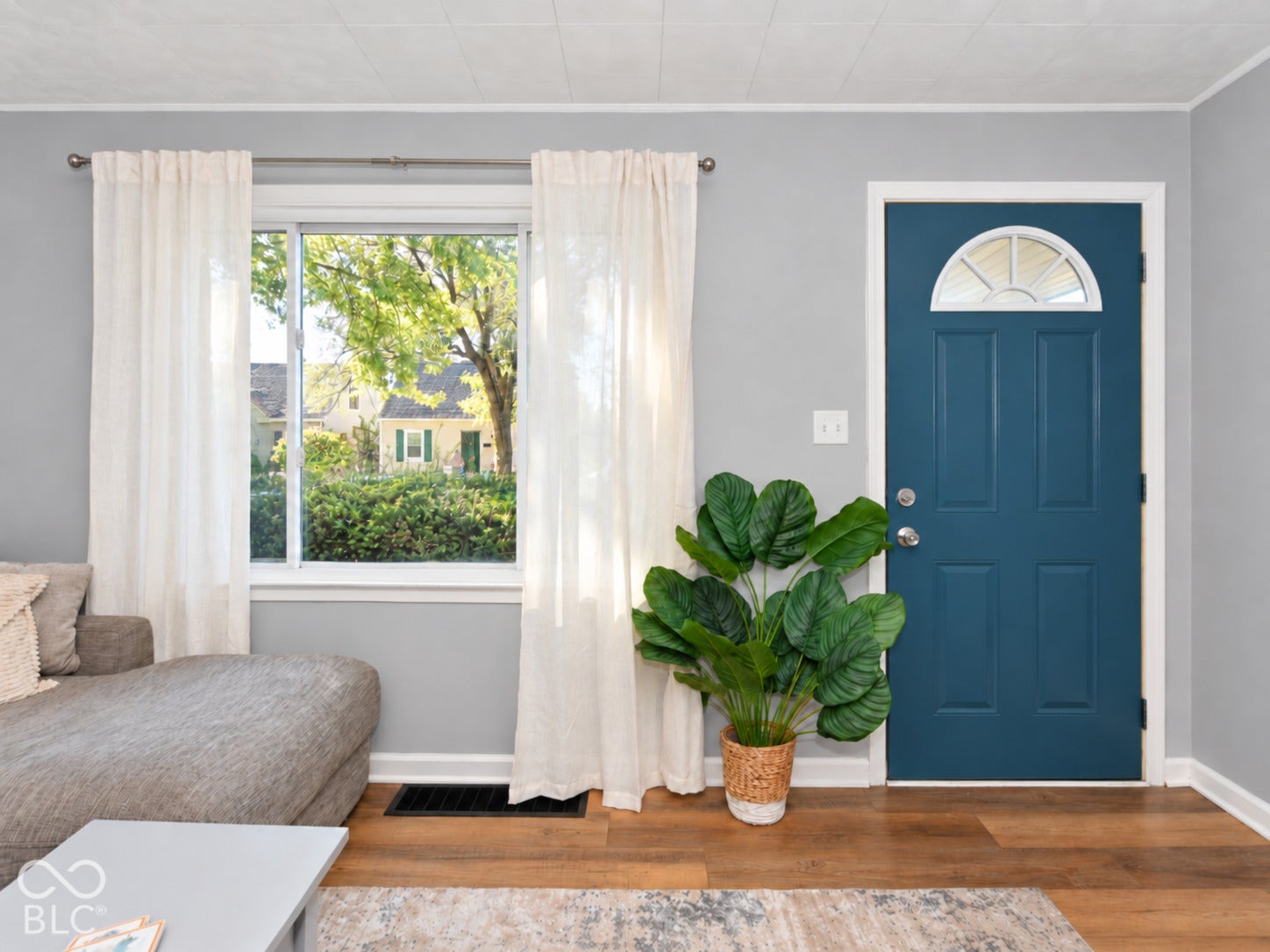 Wood-finish flooring with light gray wall paint