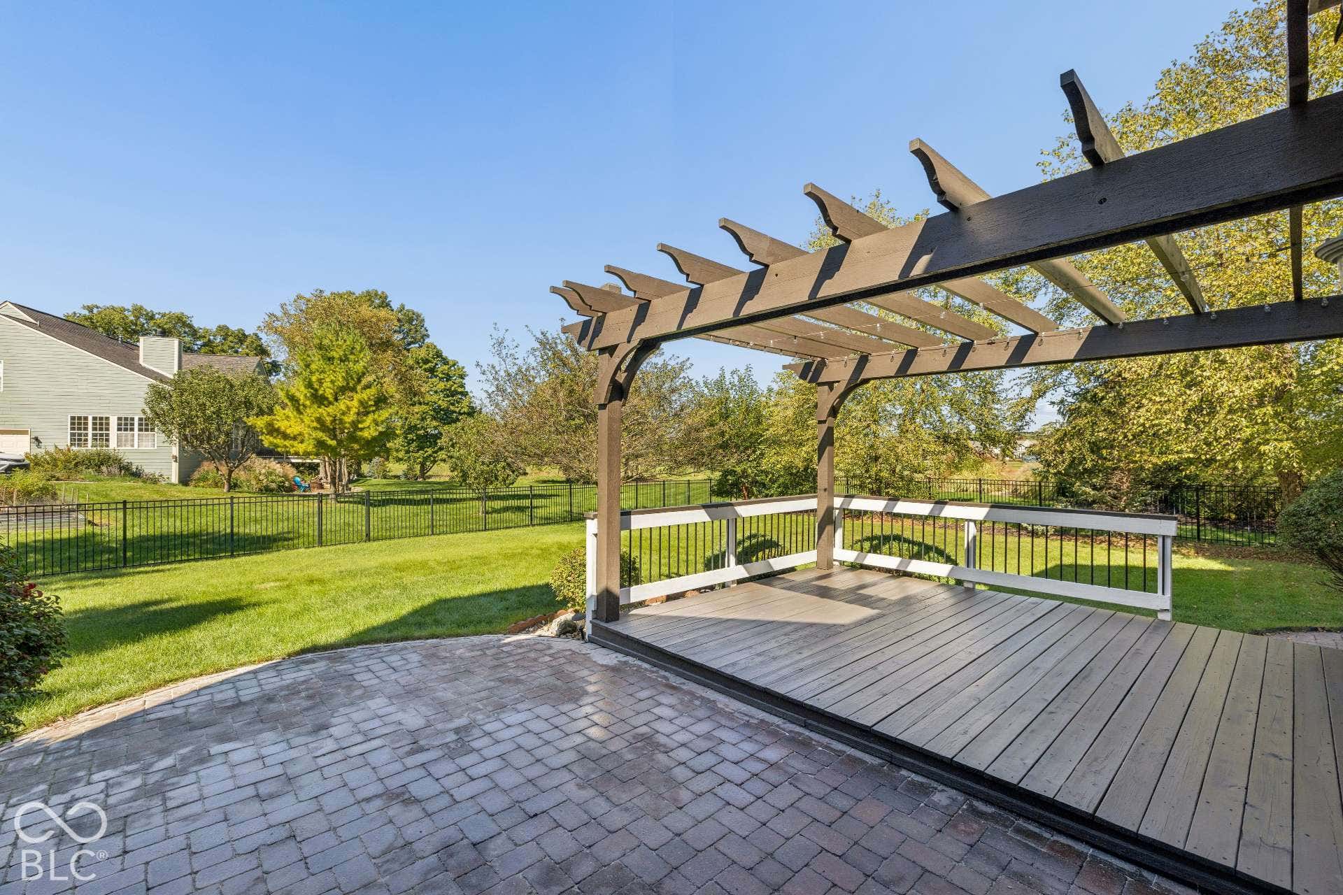 Step outside to the paver patio and pergola beautiful setting.