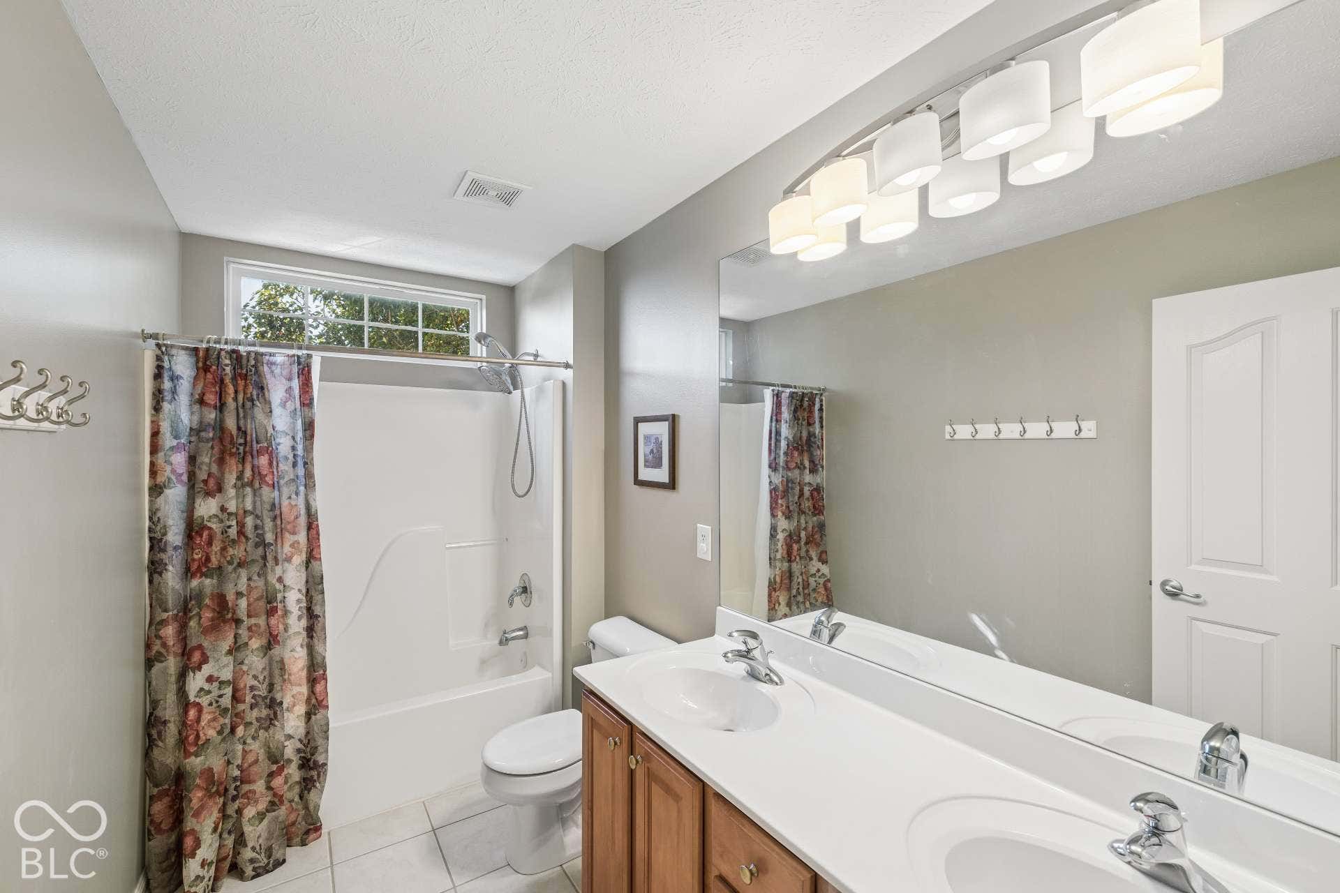Full upper-level bath conveniently serves the secondary bedrooms.