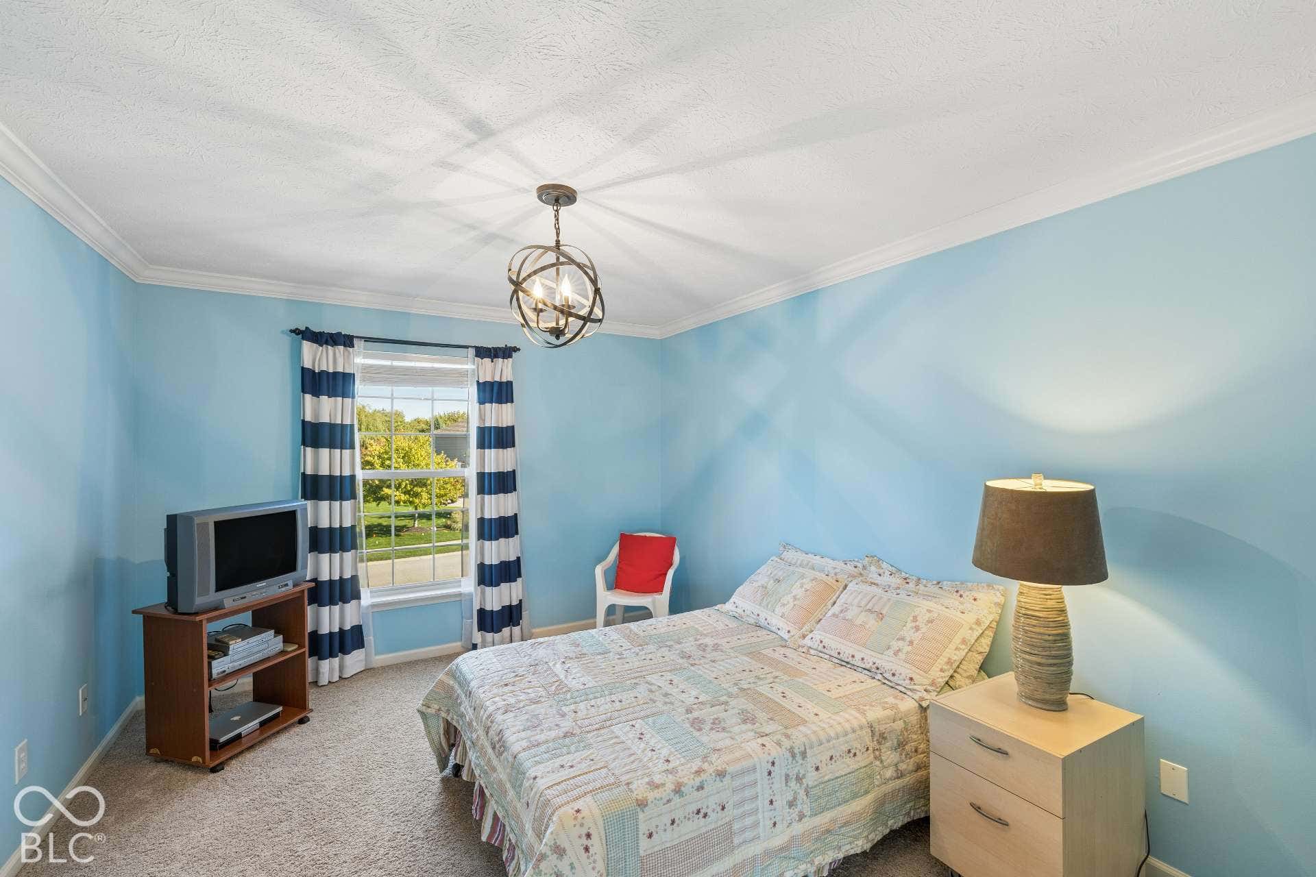 Generously sized secondary bedroom offers plenty of flexibility for family, guests or a home office.