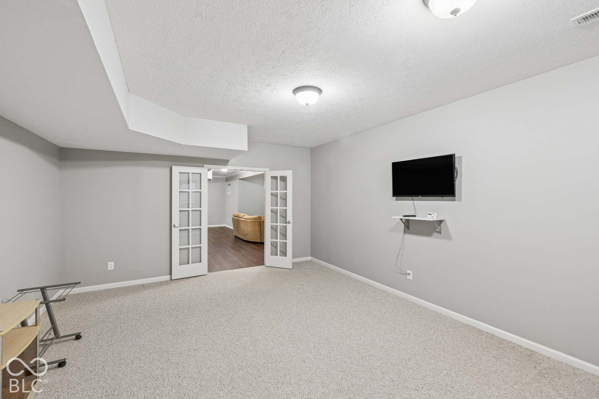 Fifth bedroom in the finished basement provides excellent space for guests, exercise room, or flex space.