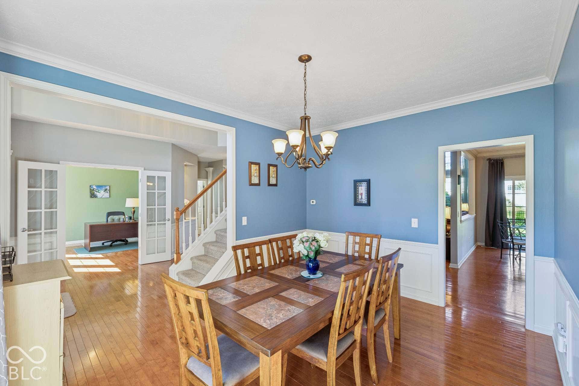 Another view shows the dining room's generous size and easy connection to the surrounding living spaces.