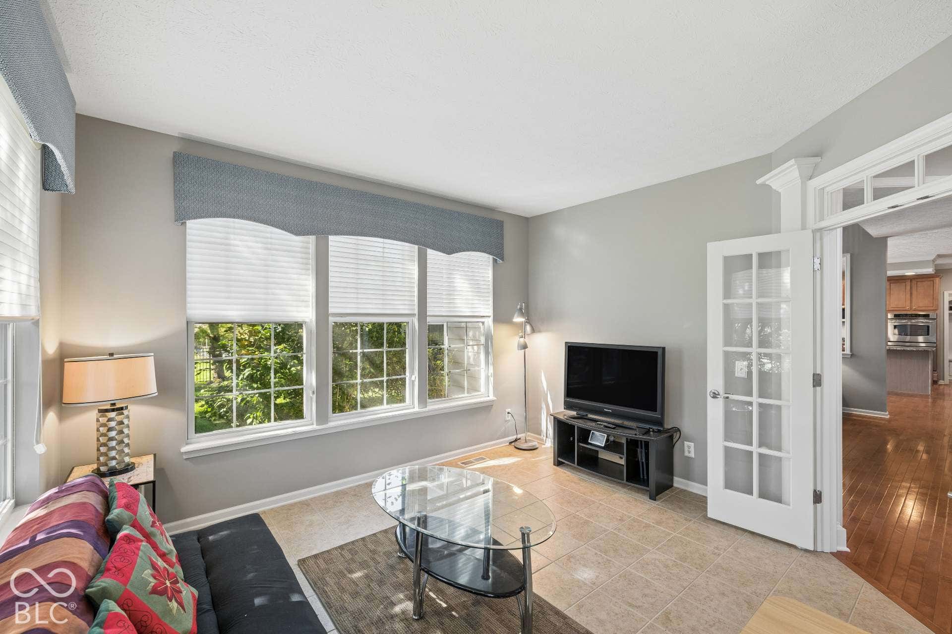 Main-Level Flex Space. A separate light-filled living space offers flexibility for a 2nd office, sitting room, music room or additional gathering area.