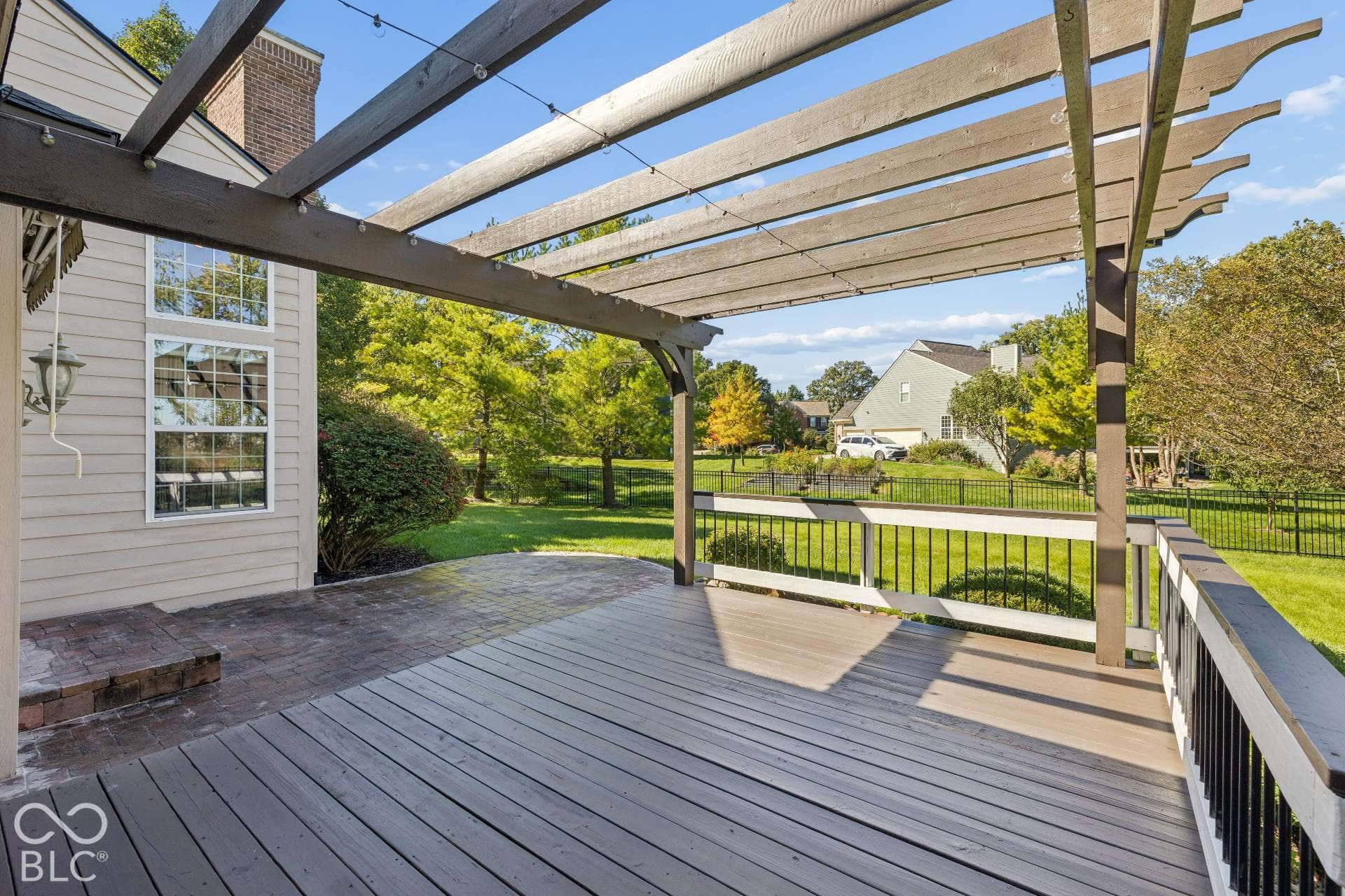 The pergola creates an inviting setting for morning coffee, outdoor dining and evenings overlooking the beautiful backyard and sunsets.