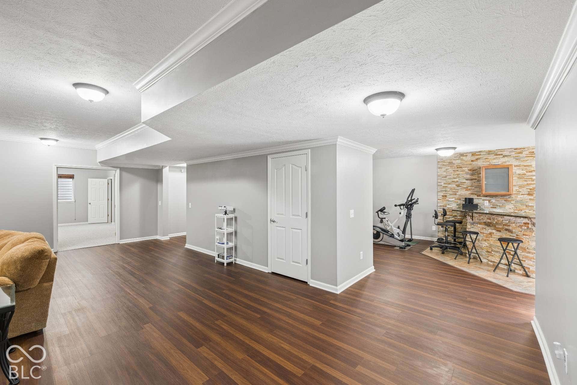 Expansive finished basement offers multiple areas for recreation, entertaining, hobbies or exercise.