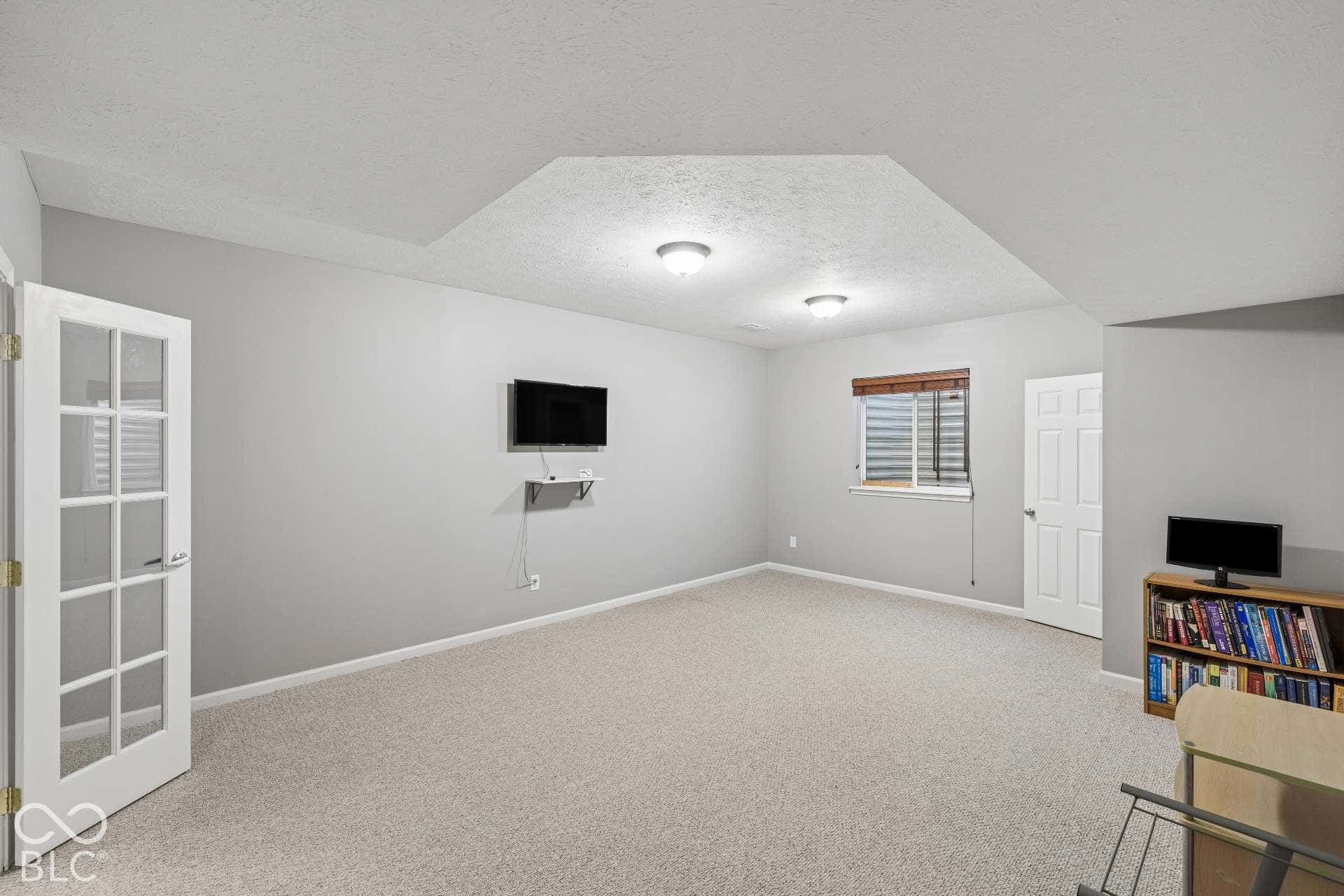 Fifth bedroom in the finished basement provides excellent space for guests, exercise room, or flex space.