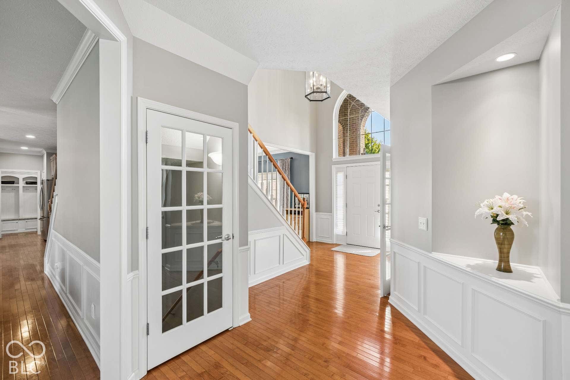 French doors and hardwood floors add character while connecting the home's main-level living spaces.