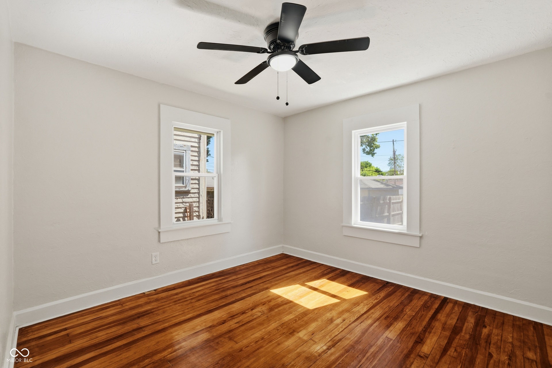 Wood-finish flooring with white trim