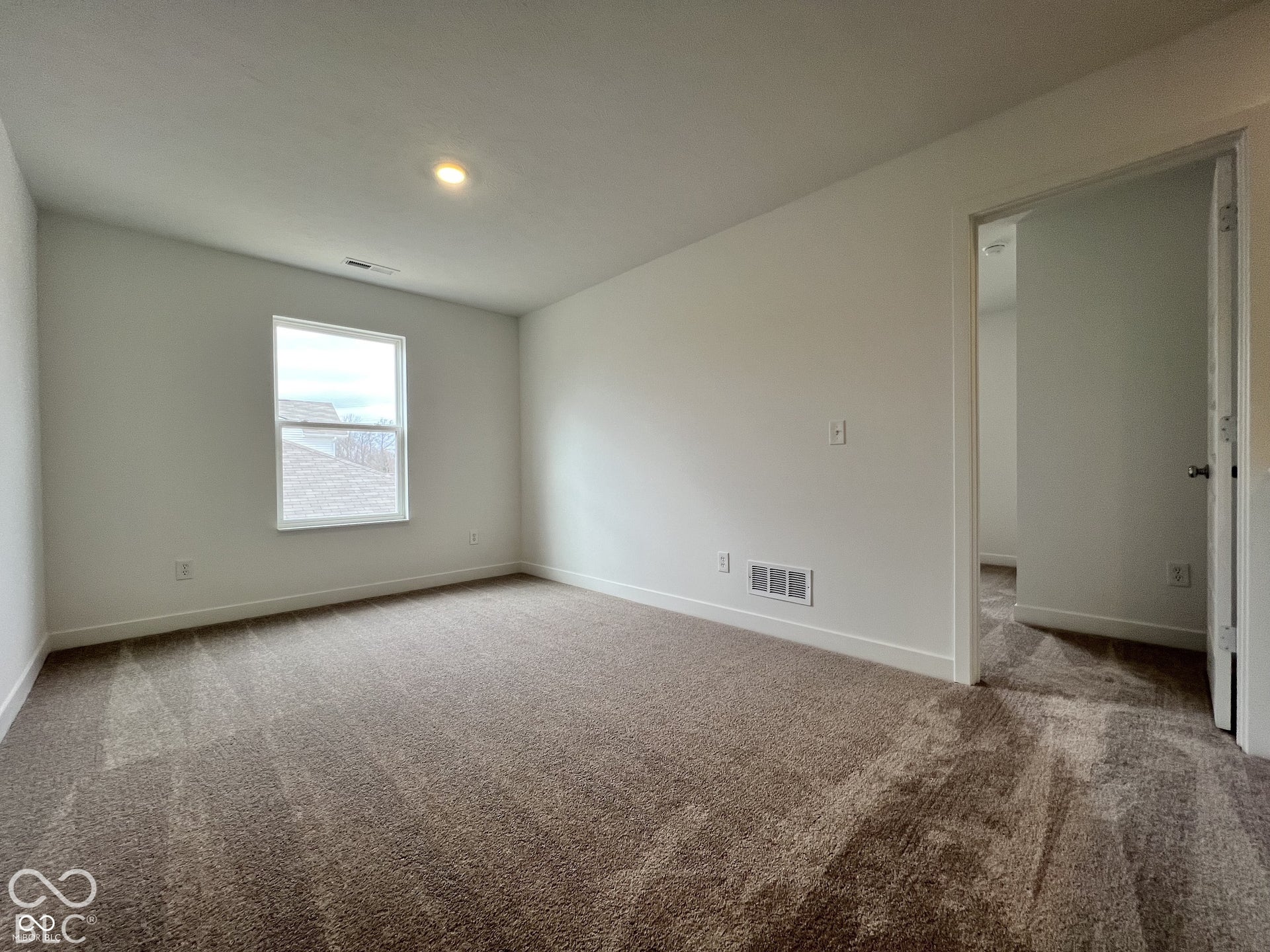 Recessed lighting, neutral wall paint, single window, and carpeted flooring