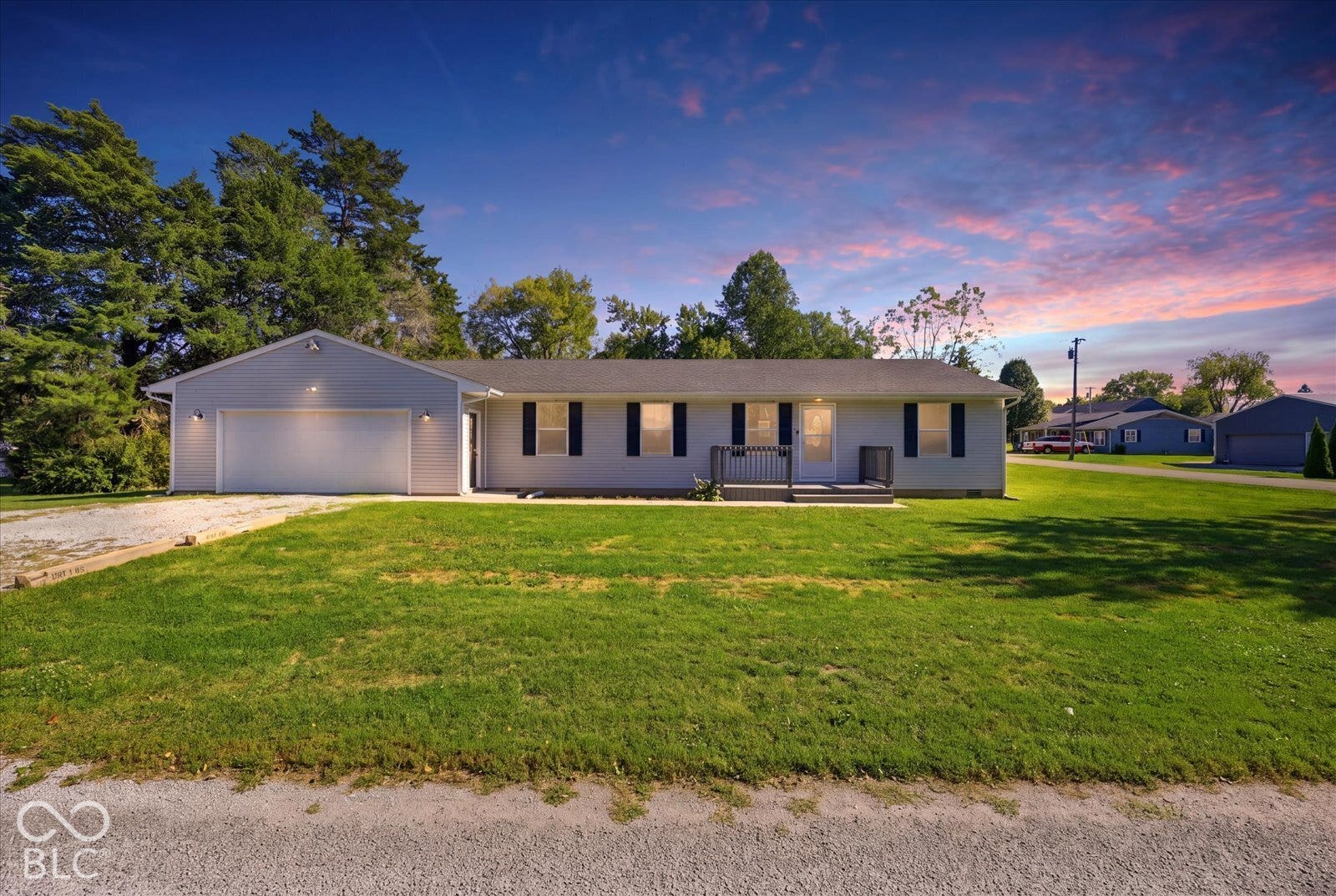 Virtually Altered - Ranch home with 2-car attached garage and gravel driveway