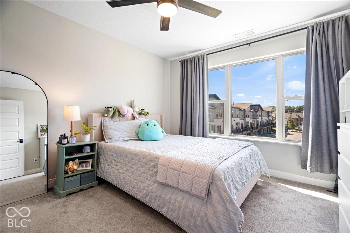 Recessed lighting, ceiling fan, and carpeted flooring