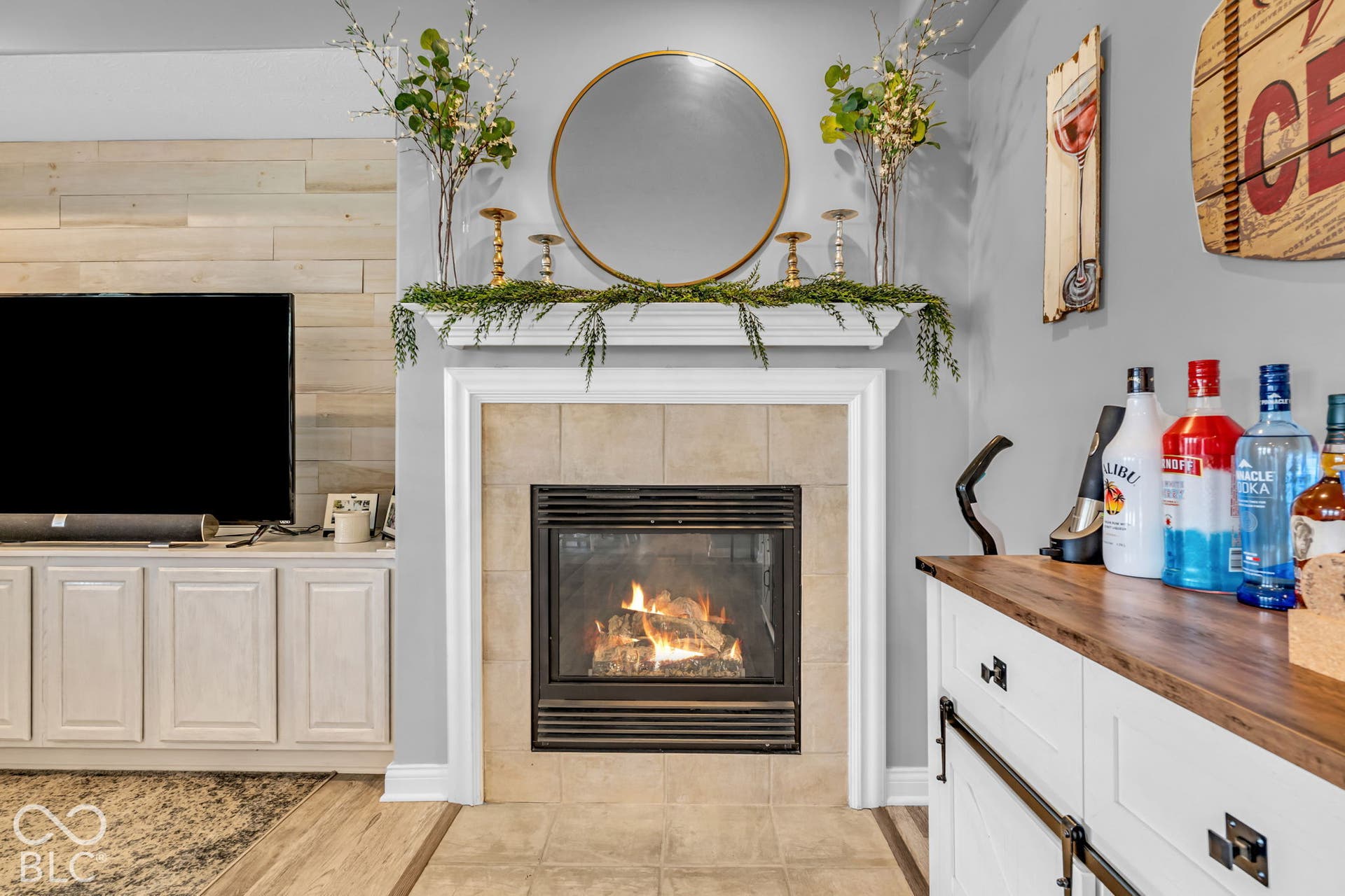 Fireplace with a tile surround and mantel