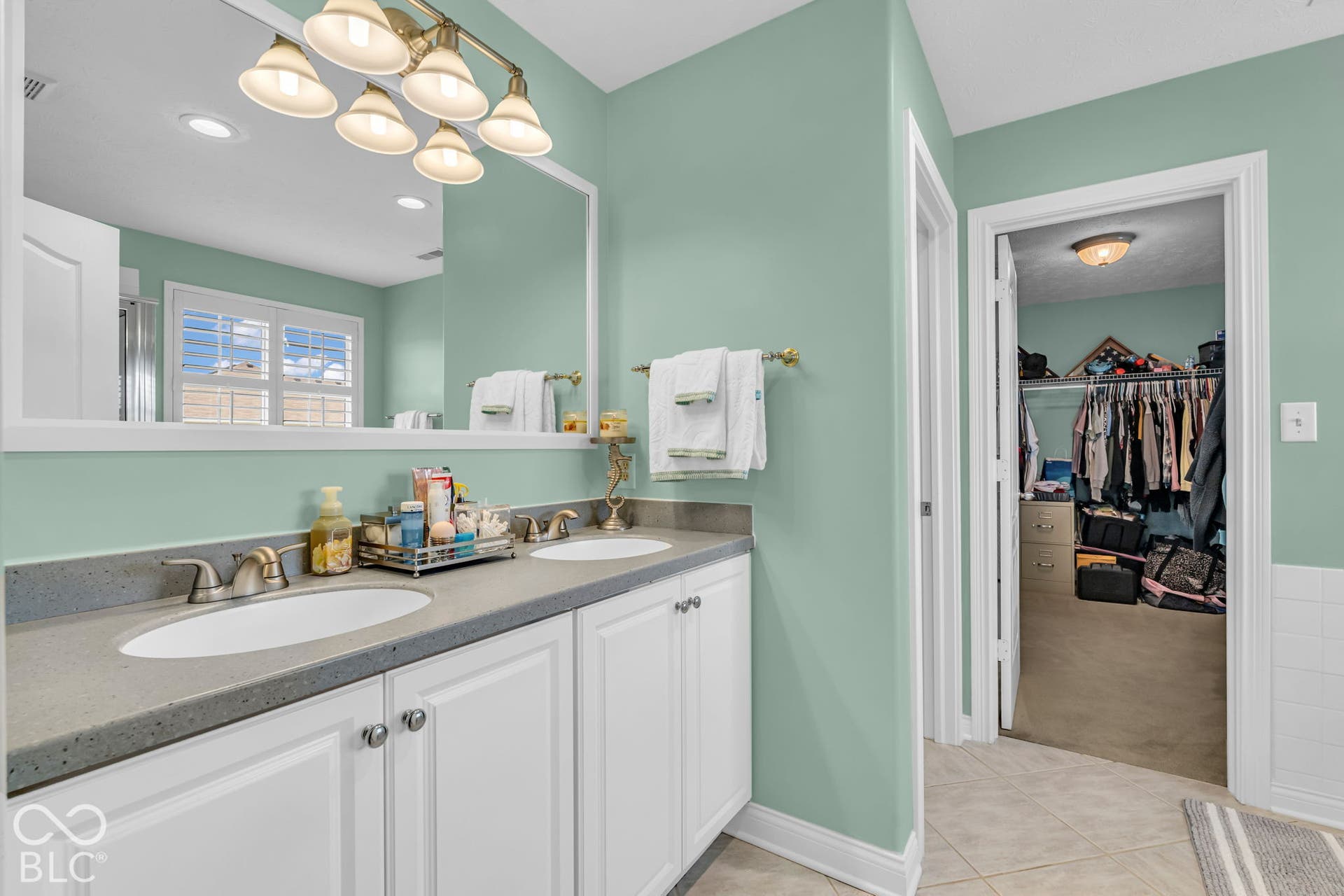 Dual vanity with undermount sinks and a gray countertop