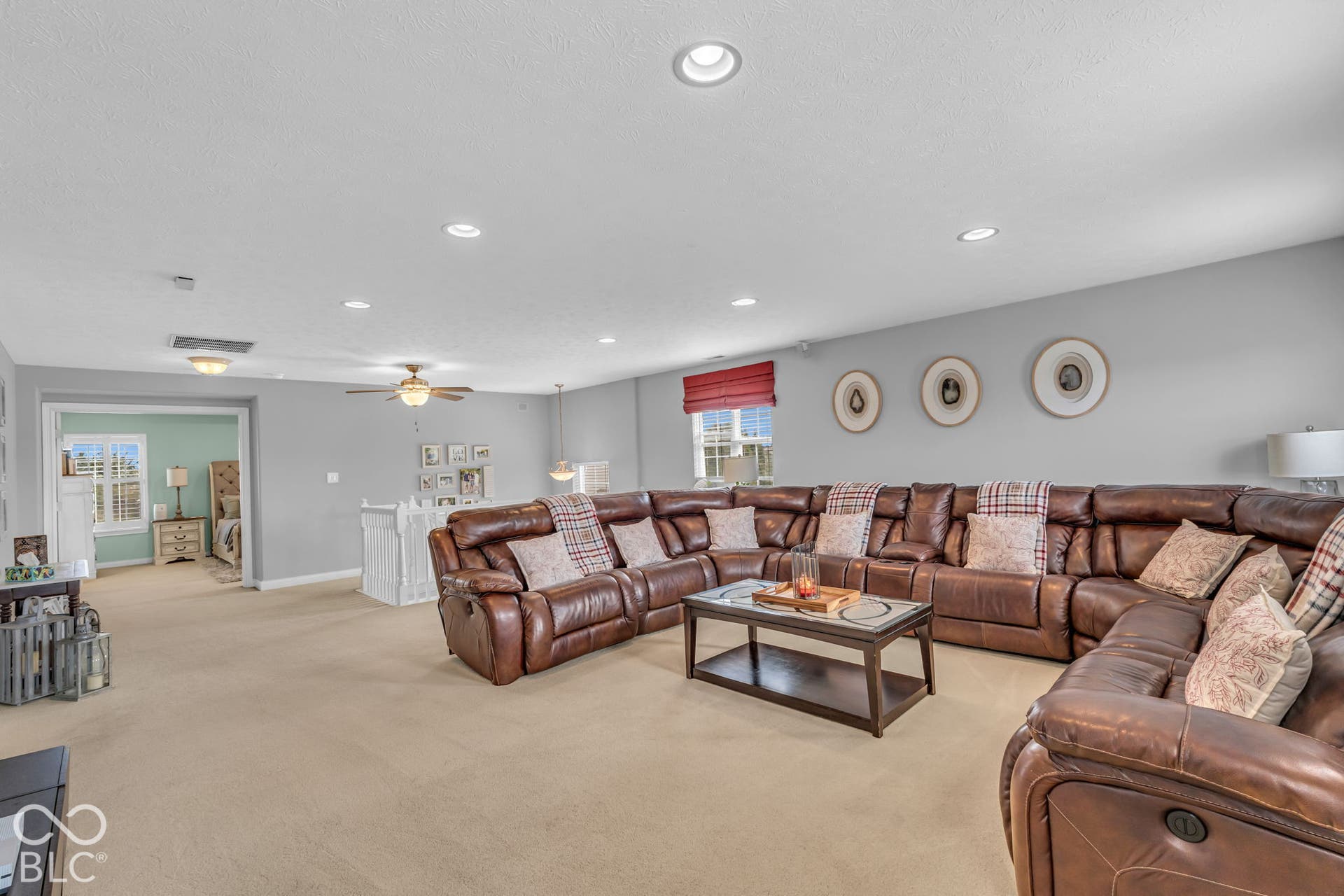 Recessed lighting, ceiling fan, and carpeted flooring