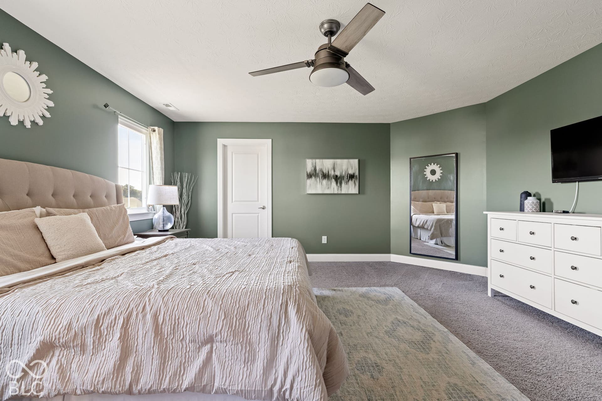 Recessed lighting, ceiling fan with light fixture, carpeted flooring, window, and a white paneled door