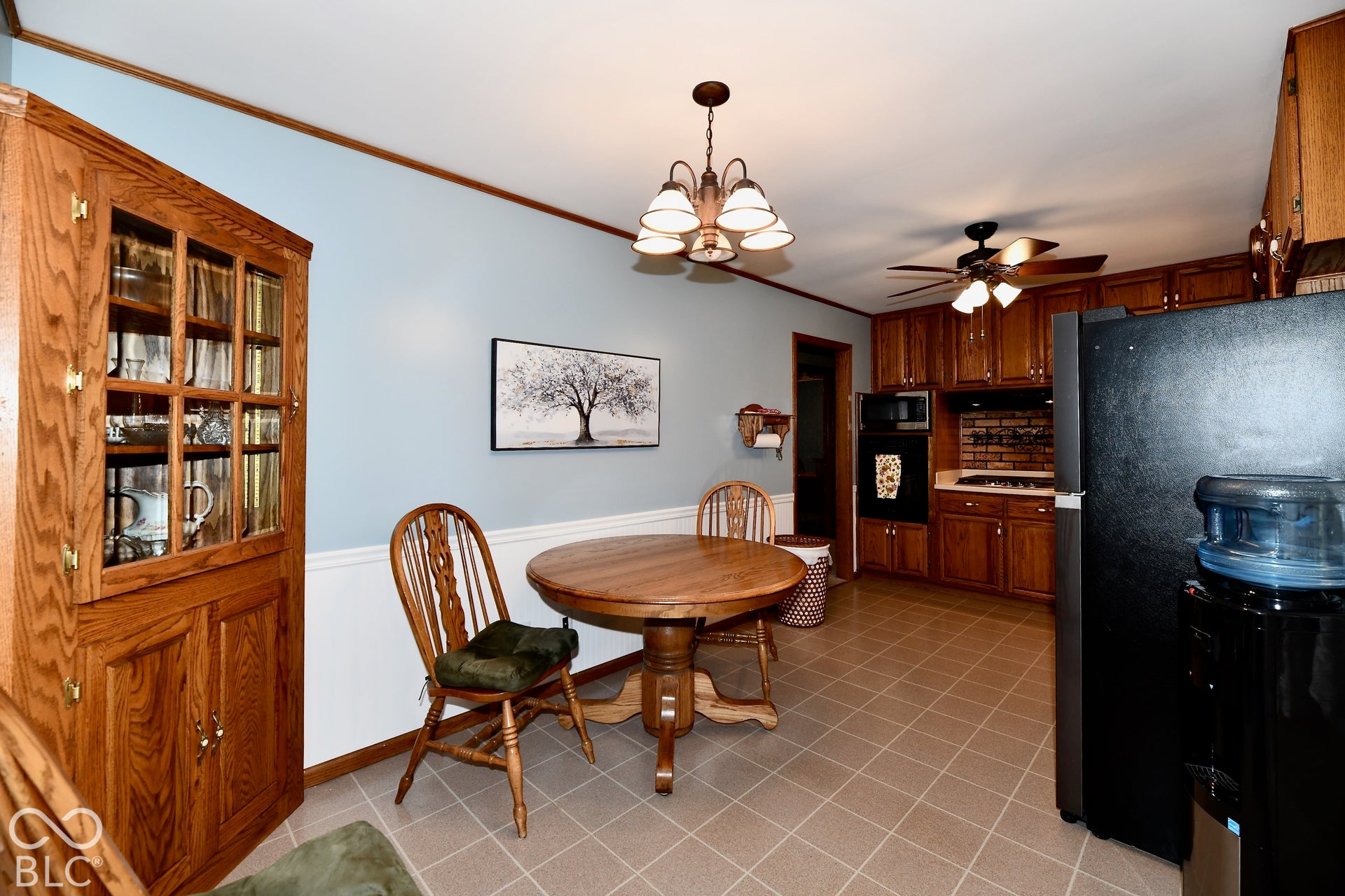 Custom corner cabinet with glass-front and vinyl flooring