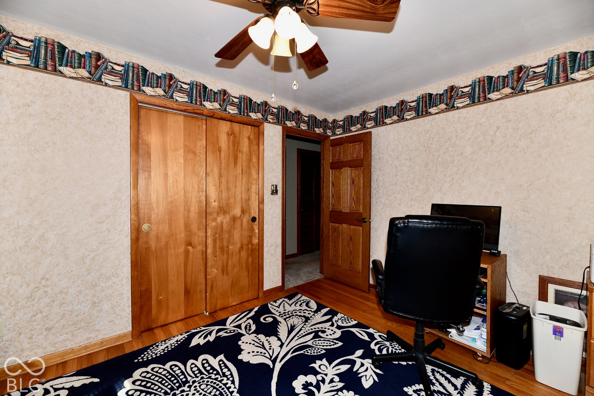 Bedroom 3 with refinished hardwood flooring and fantastic storage in the deep closet space.
