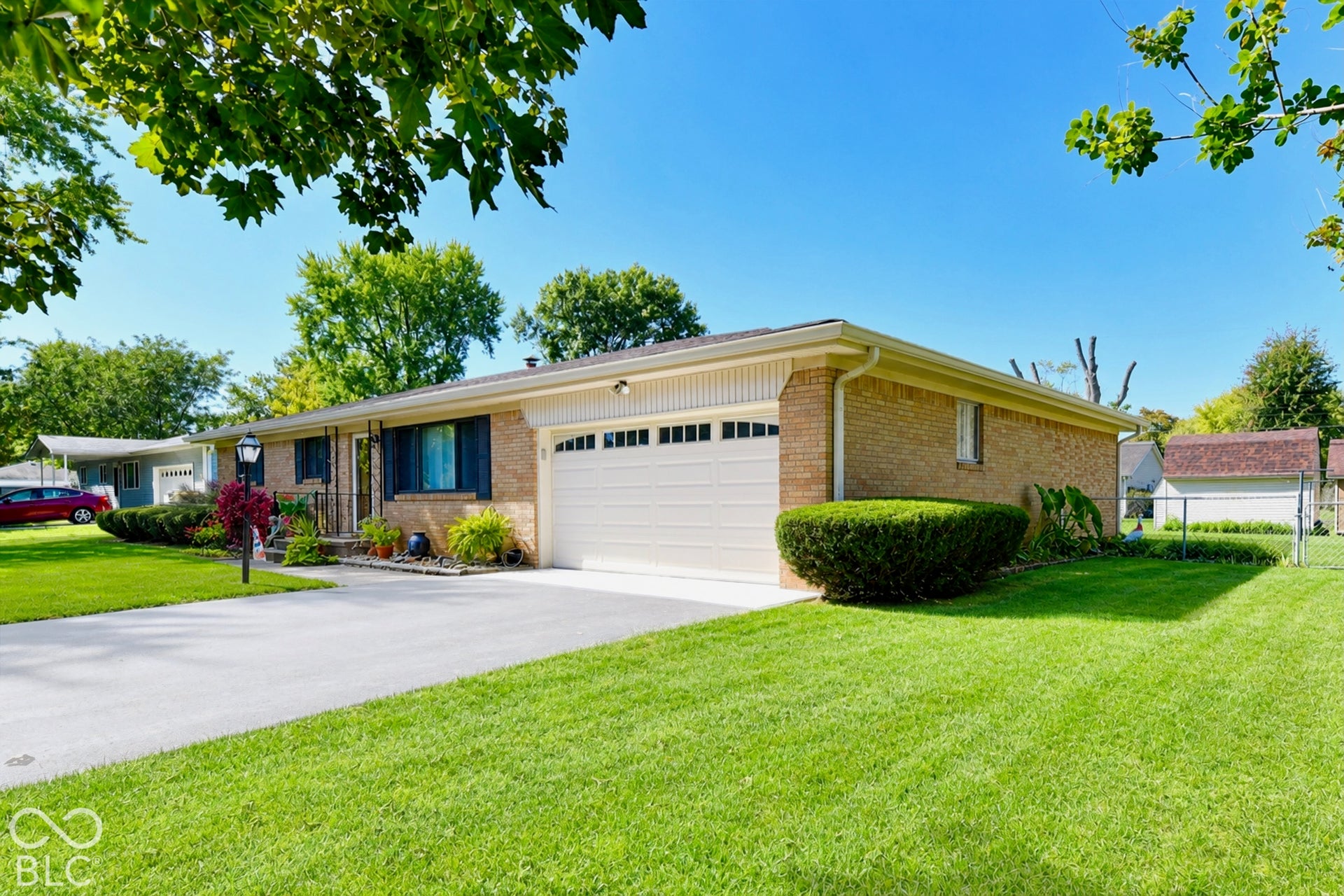 Low maintenance exterior, attached garage with neutral door, and curb appeal
