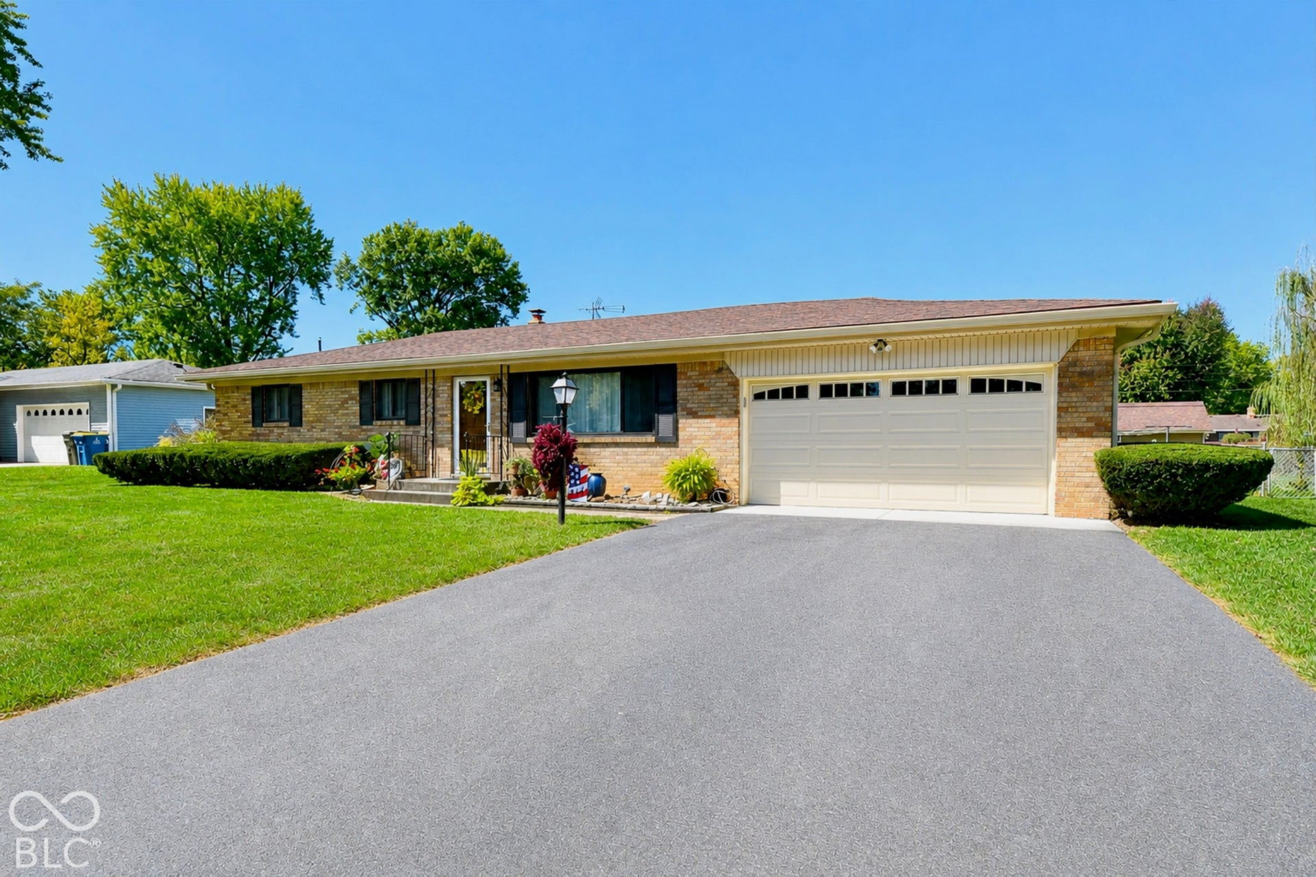 Low maintenance exterior, attached garage with neutral door, and curb appeal (Garage Apron repoured in July 2026) & partial fence