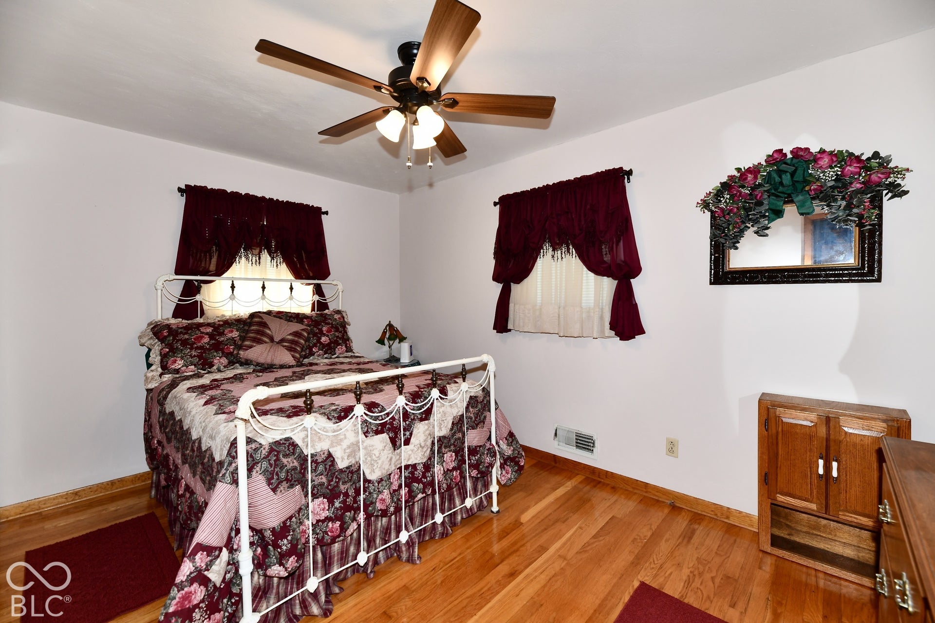 Bedroom 4 was one considered the primary bedroom until the addition of the current primary a number of years ago.  Boasts refinished hardwood flooring, a 1/2 bath ensuite and deep closet storage space.