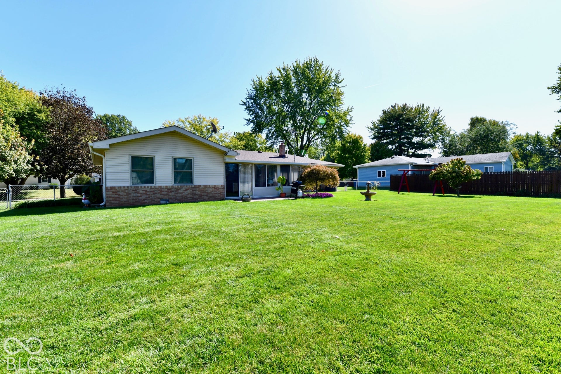 Spacious rear yard with paver patio