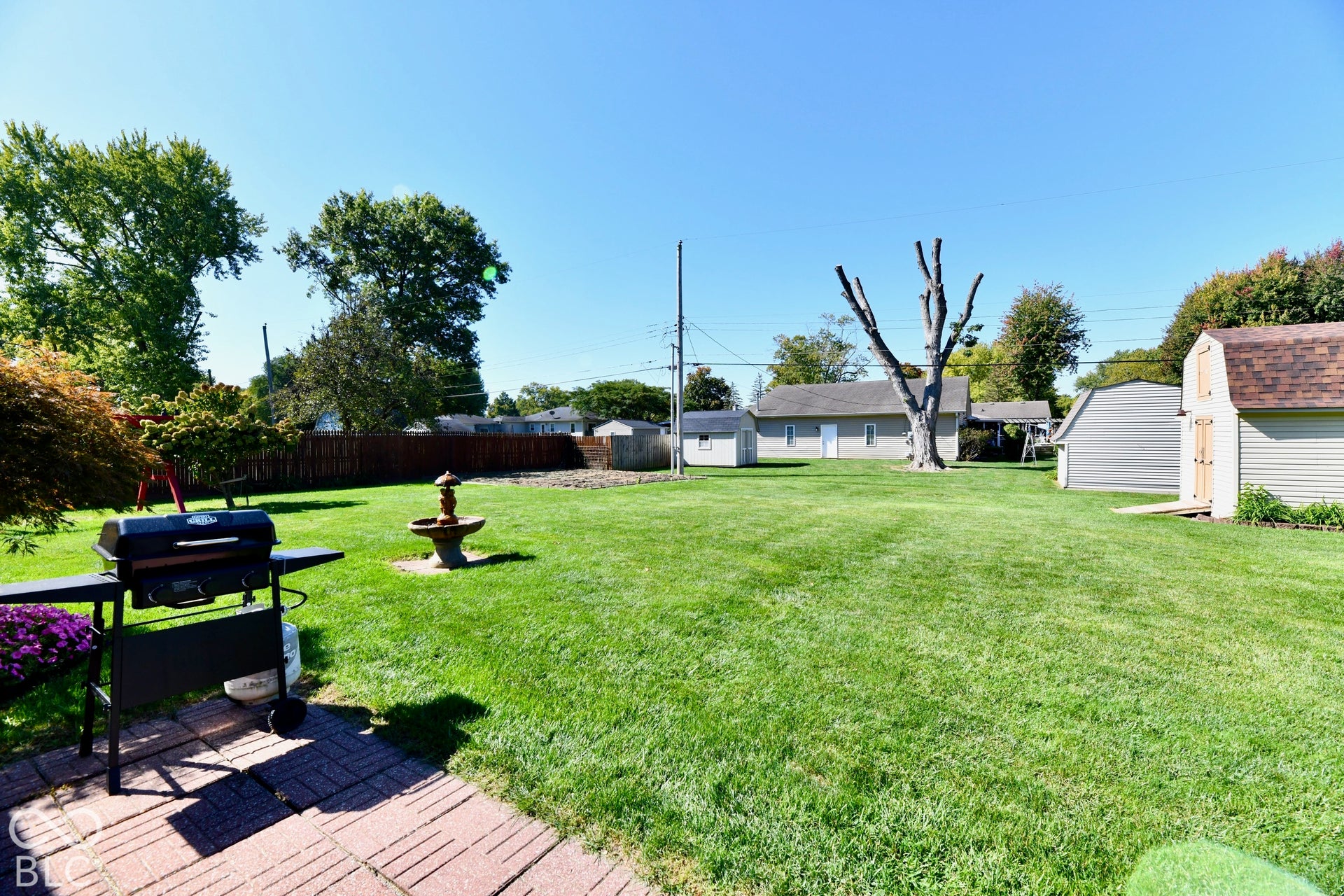 Expansive .35 acre yard with a brick paver patio